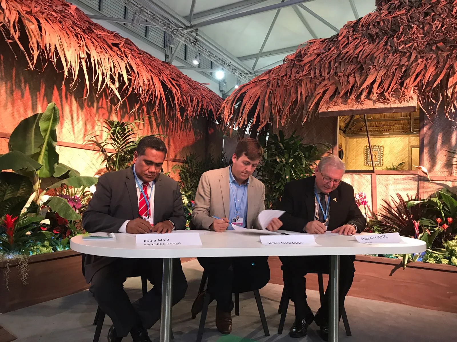 Delegates sign the agreement for solar on St George's Palace. From left to right: Tonga's Paula Mau'u, SHOS's James Ellsmoor and PIDF's François Martel.