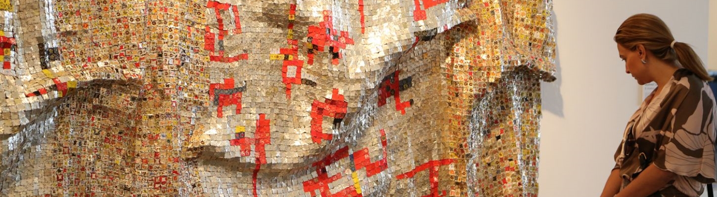 El Anatsui has gained widespread international acclaim in recent years for his dazzling metallic tapestries made from liquor bottle tops. 