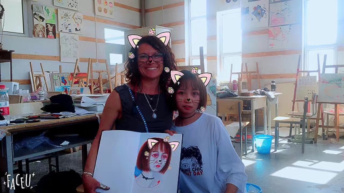 In the drawing classroom with one of my students. They LOVE these apps with the cute effects.