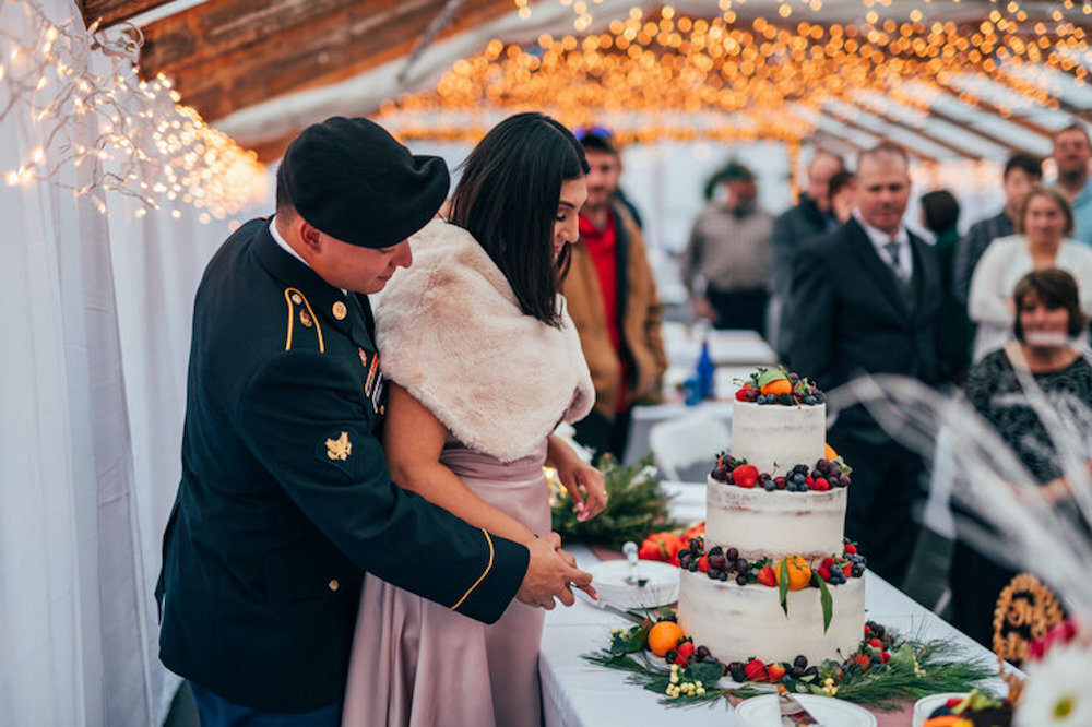 couple cutting cake at wedding.jpg