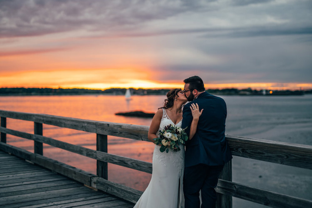 Couple kissing on pier.jpg