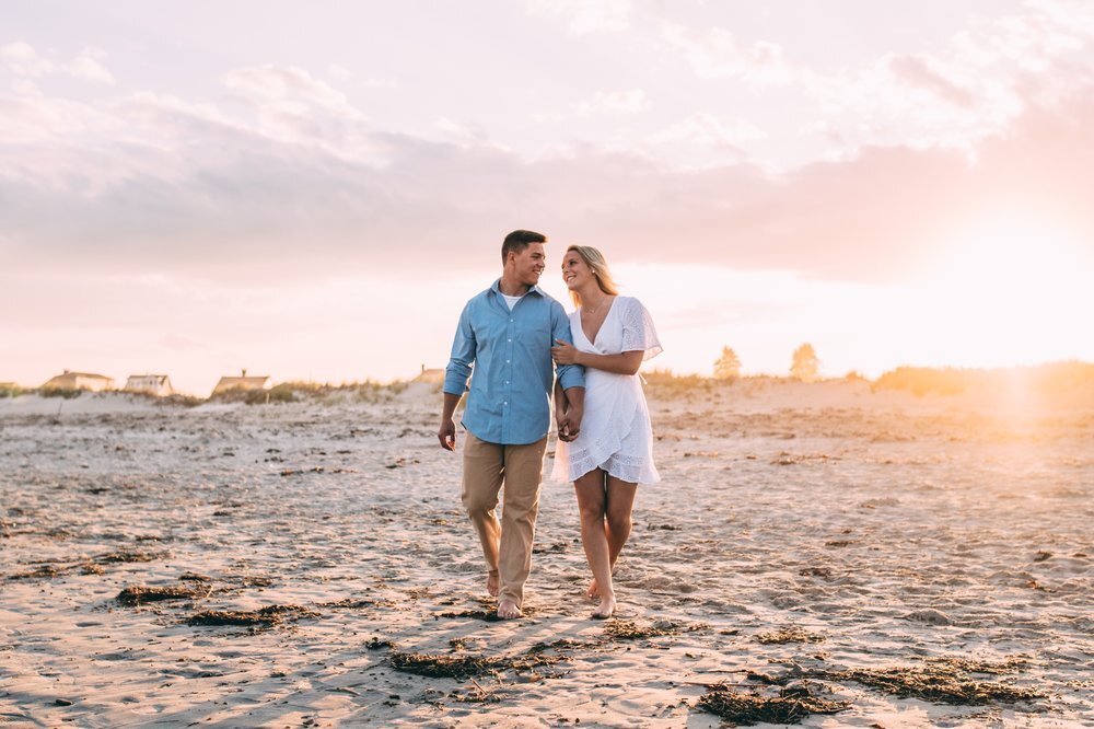 Couple on beach for engagement shoot.jpeg