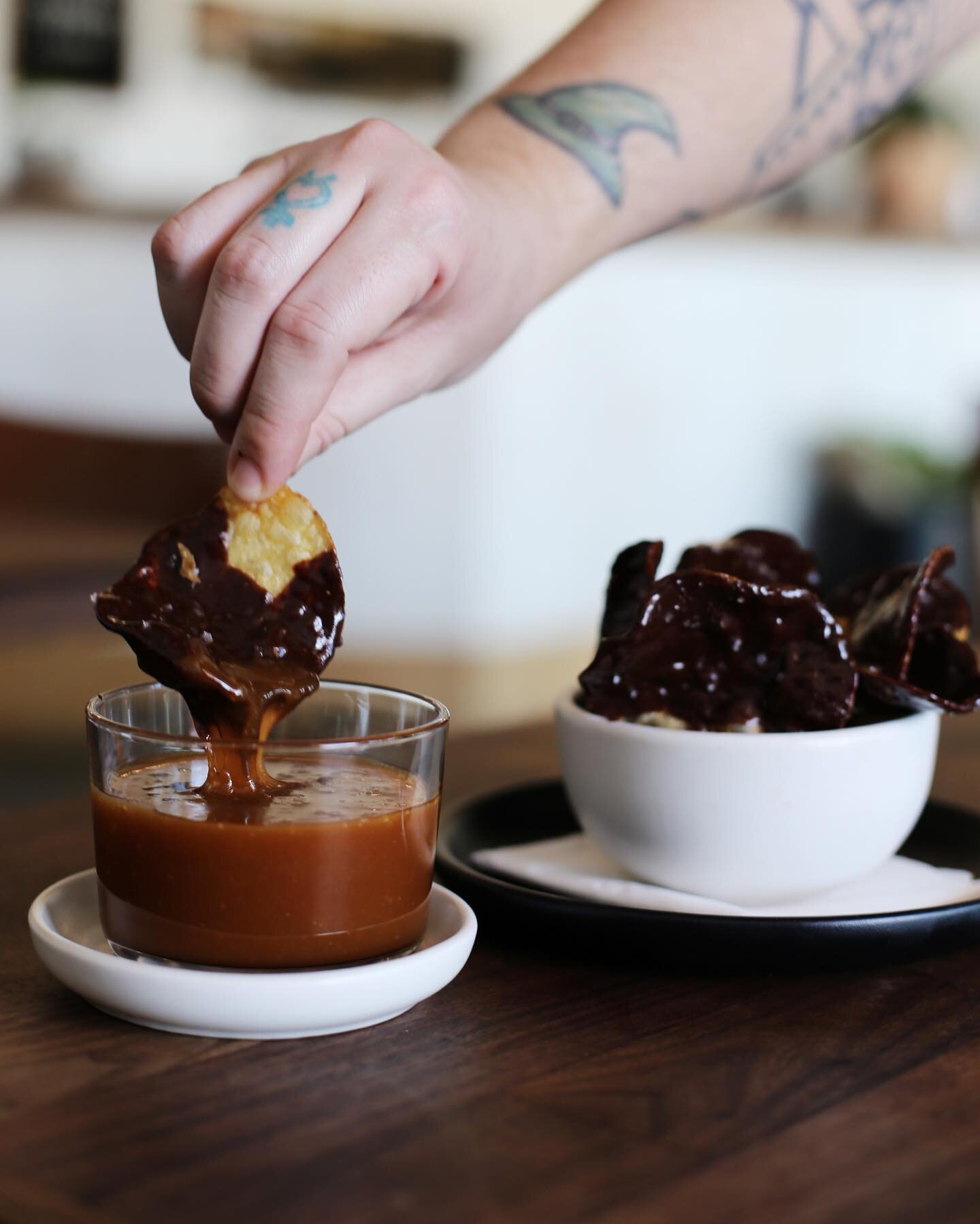 Chips and dip, but for your sweet tooth. We&rsquo;re dipping our house made sea salt potato chips in dark chocolate and serving them with dulce de leche dipping sauce this weekend, come through. Available tomorrow through Sunday while supplies last.