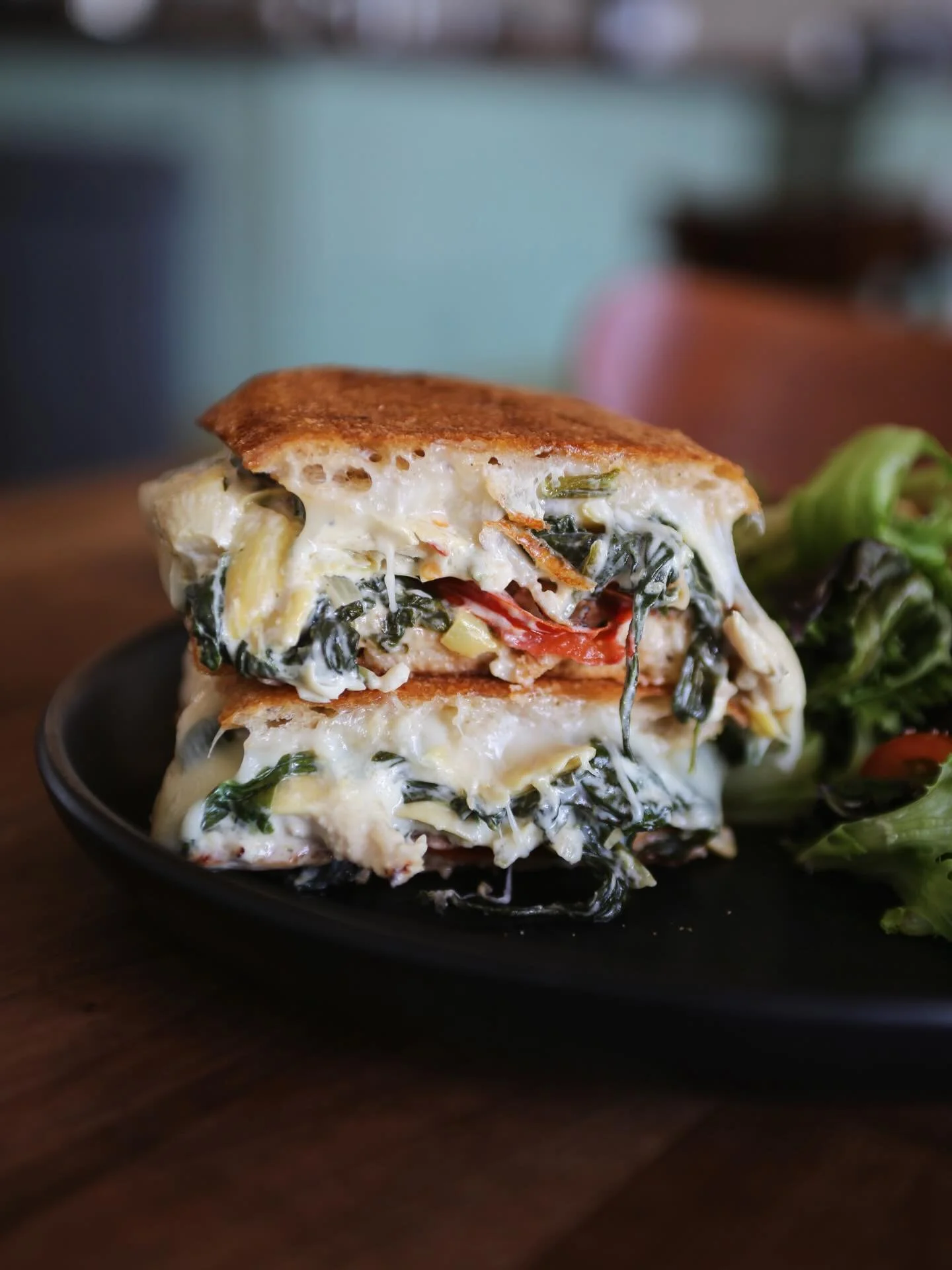 Your mom&rsquo;s favorite sandwich is back! Our WORTH TAKEAWAY WEEKLY FEATURE is the Chicken &amp; Artichoke Panini! Roasted chicken, house made spinach and artichoke dip, roasted tomatoes, and melted mozzarella pressed on Noble Bread ciabatta.

Serv