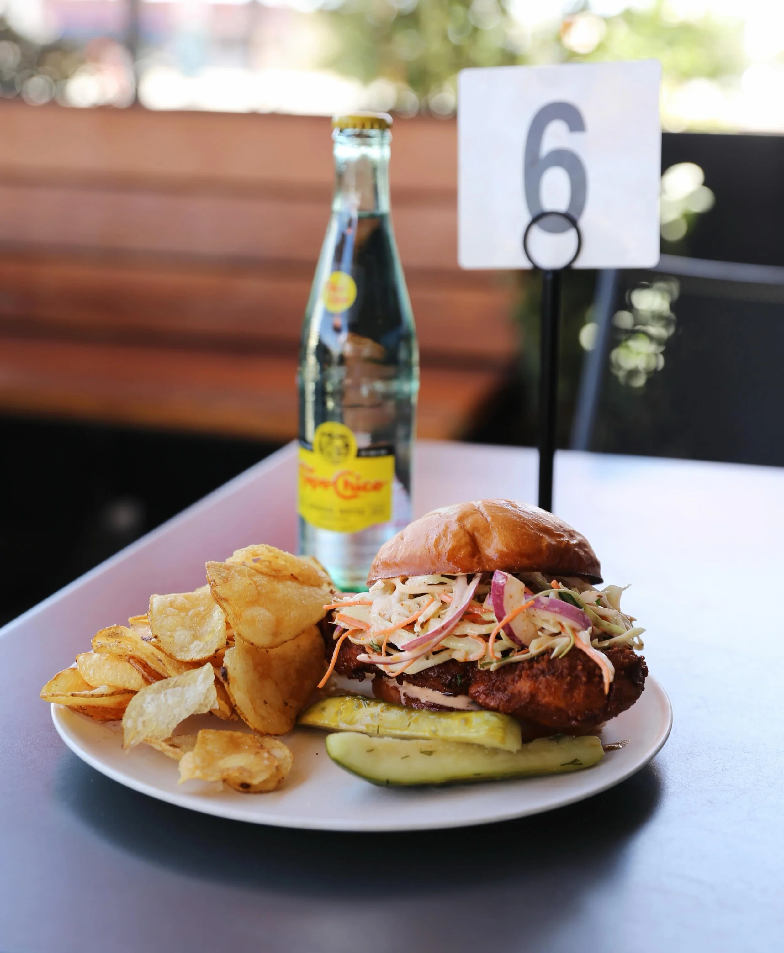 Hotter than a honky-tonk! Our WORTH TAKEAWAY WEEKLY FEATURE is The Nashville Hot Chicken Sandwich! Spicy marinated chicken breast, fried crispy and dipped in Nashville hot oil, with cayenne buttermilk slaw and sriracha aioli, served on @noblebread br