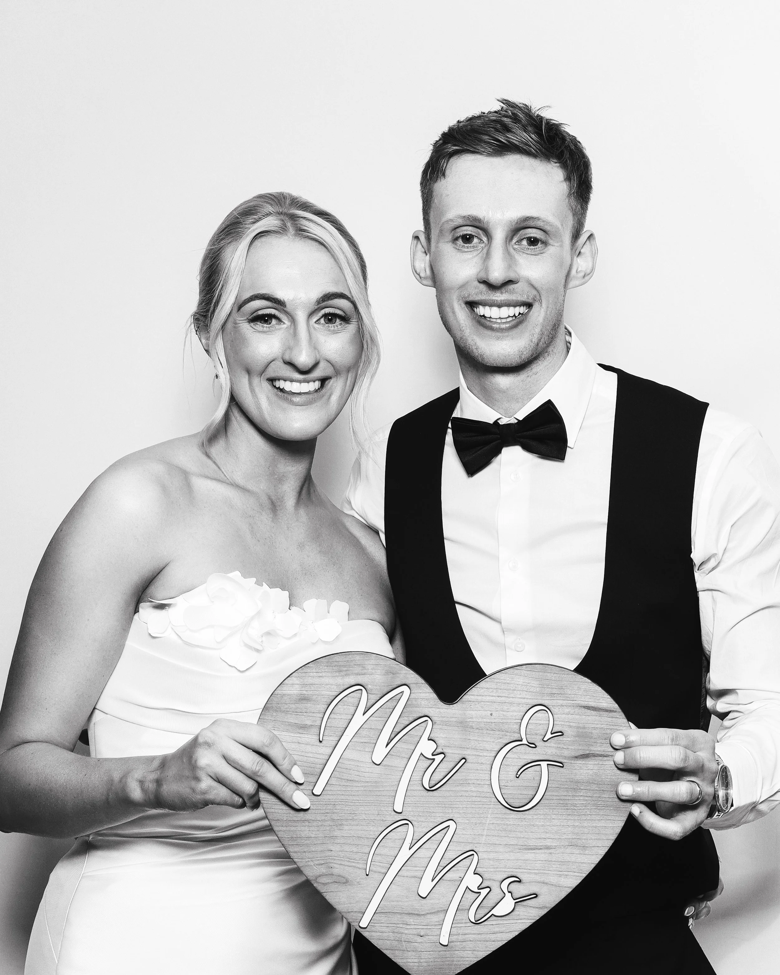 Bride and groom enjoying the ICON Photo Booth at Unique Occasions Loversall. Luxury wedding photo booth hire with instant prints, digital sharing and unforgettable memories for guests.