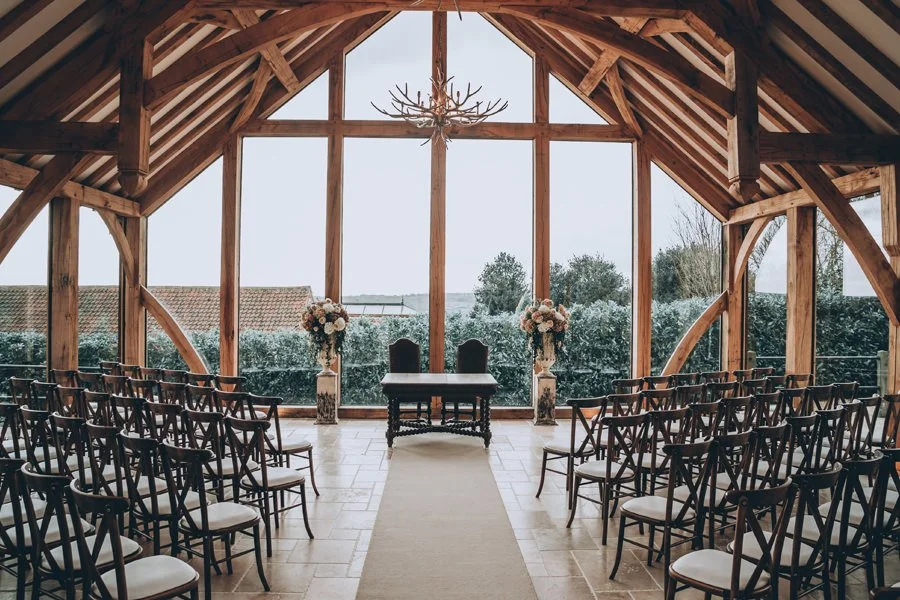 Swancar Farm Country House wedding venue near Nottingham with its large oak-framed windows and rustic ceremony space