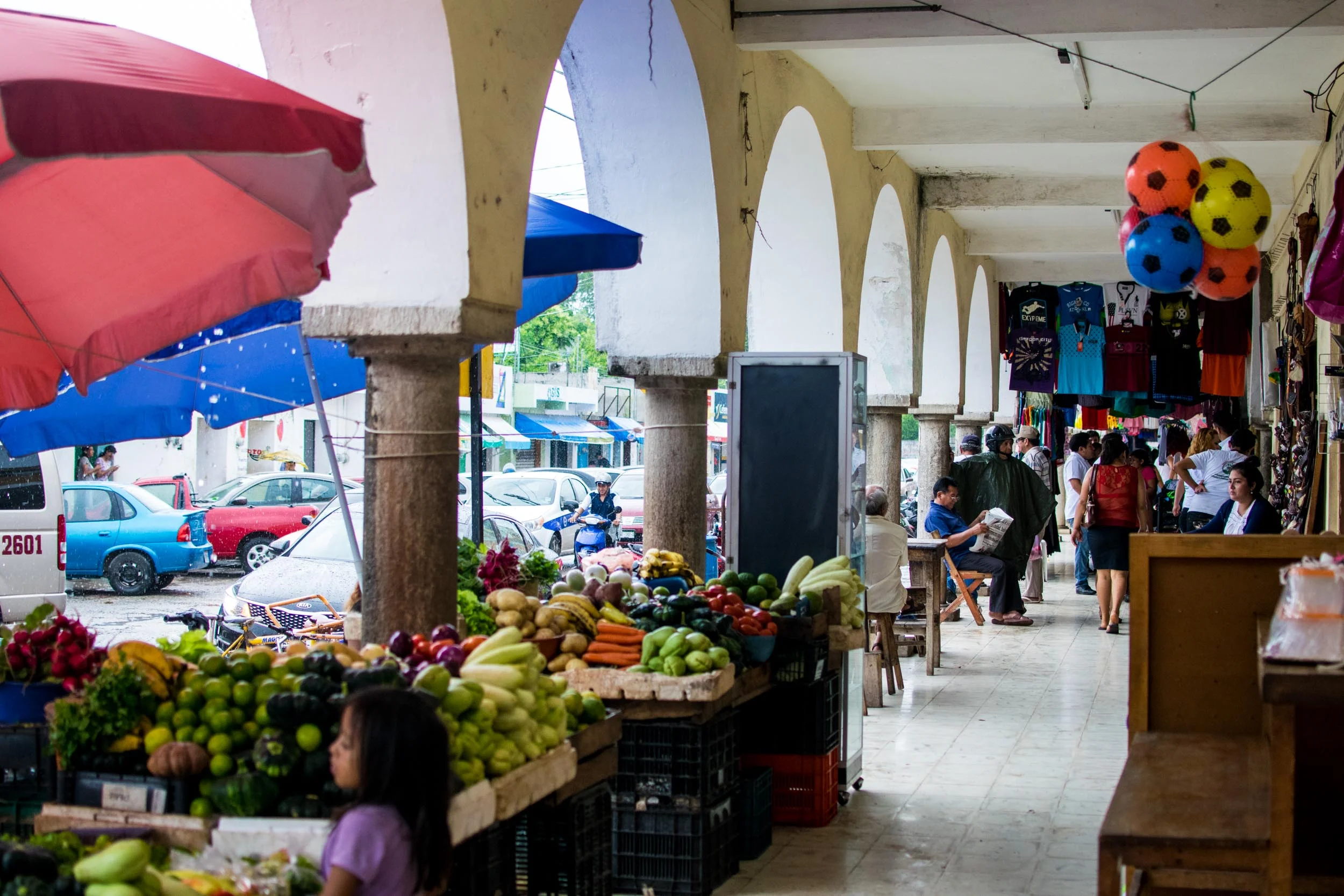 Shopping at the market on a rainy day in Valladolid, Mexico.