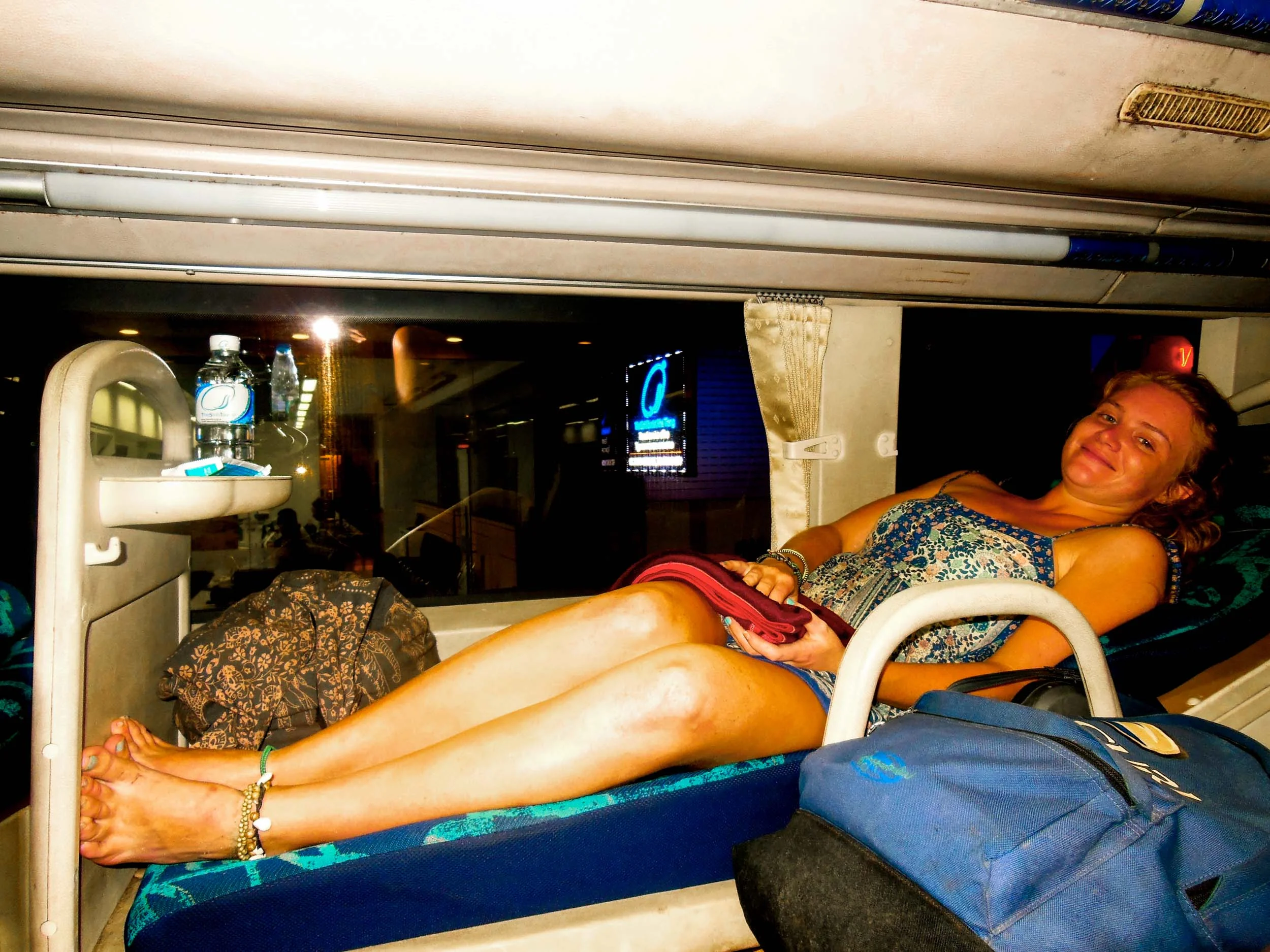 Woman on sleeper bus while backpacking in South East Asia.