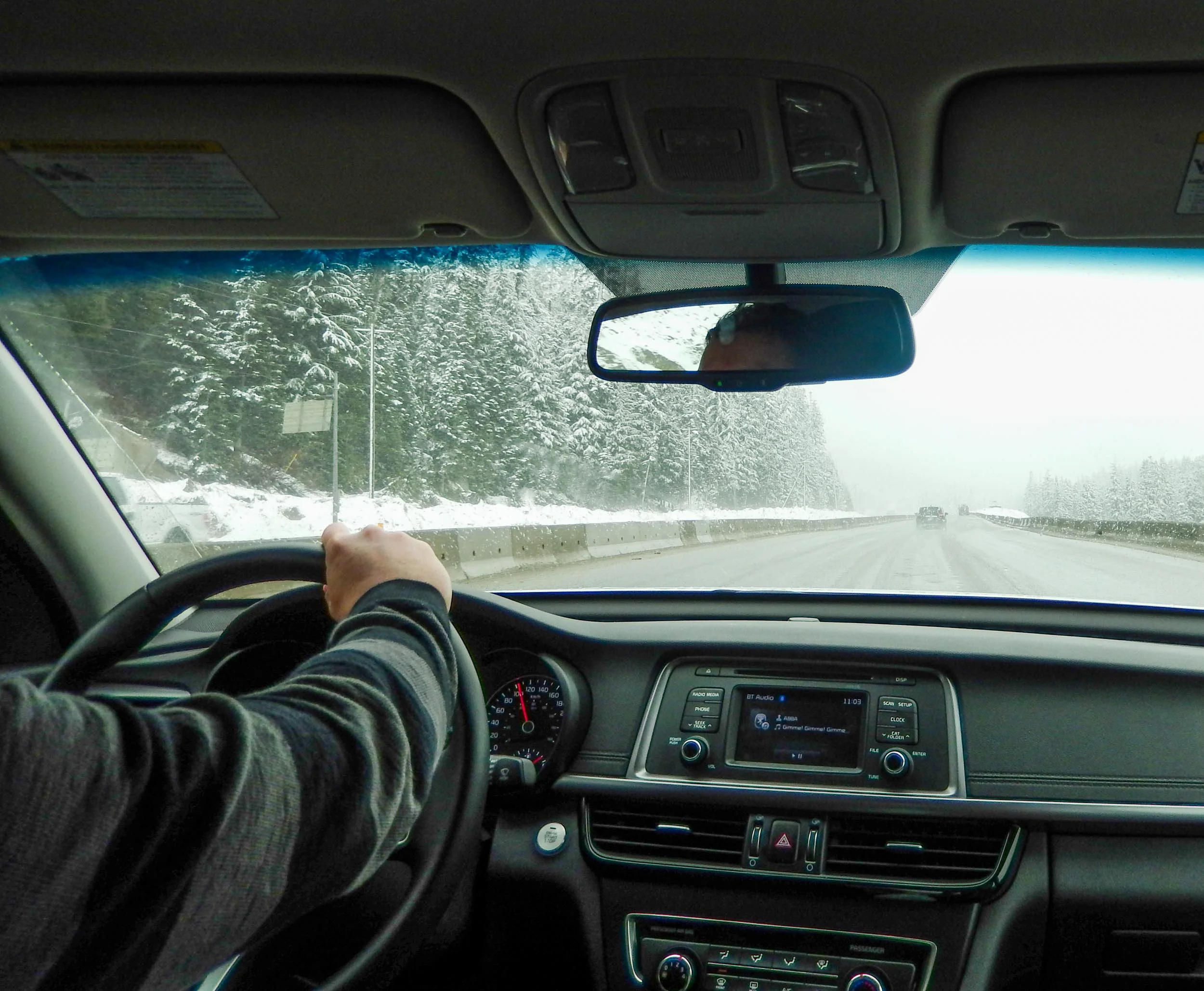Driving the Coquihalla Pass, where the elevation suddenly brought snow and more treacherous conditions. British Columbia, Canada.