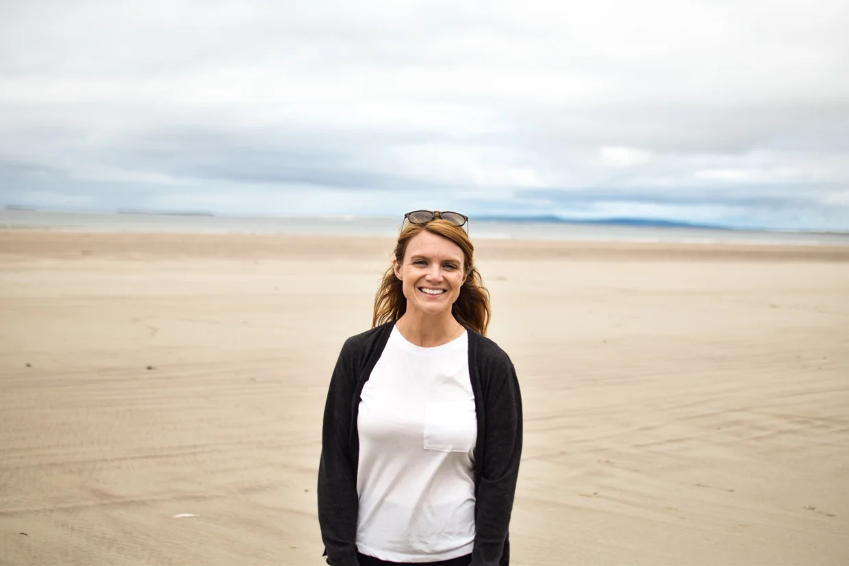 Woman stood on Kilcummin Beach, County Kerry. Part of the Dingle Peninsula in Ireland.