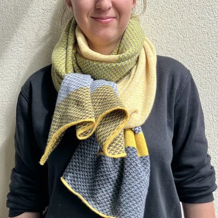 harris_lambswool_wrap_yellows_greys_model.jpeg