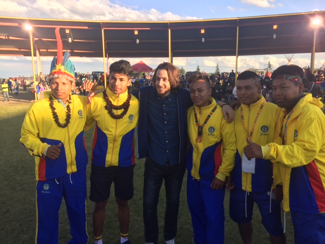Bashar Dyab from Syria and Team Colombia celebrate the start of the WIN Games