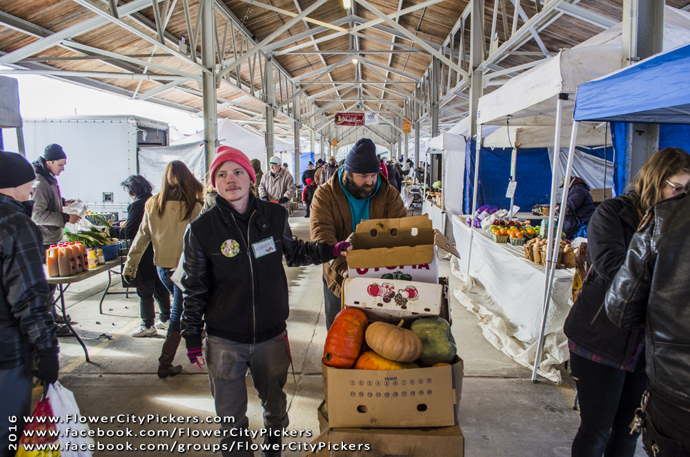 Humphrey, left, and a volunteer wheel produce through the Public Market. Photo provided by FCP.