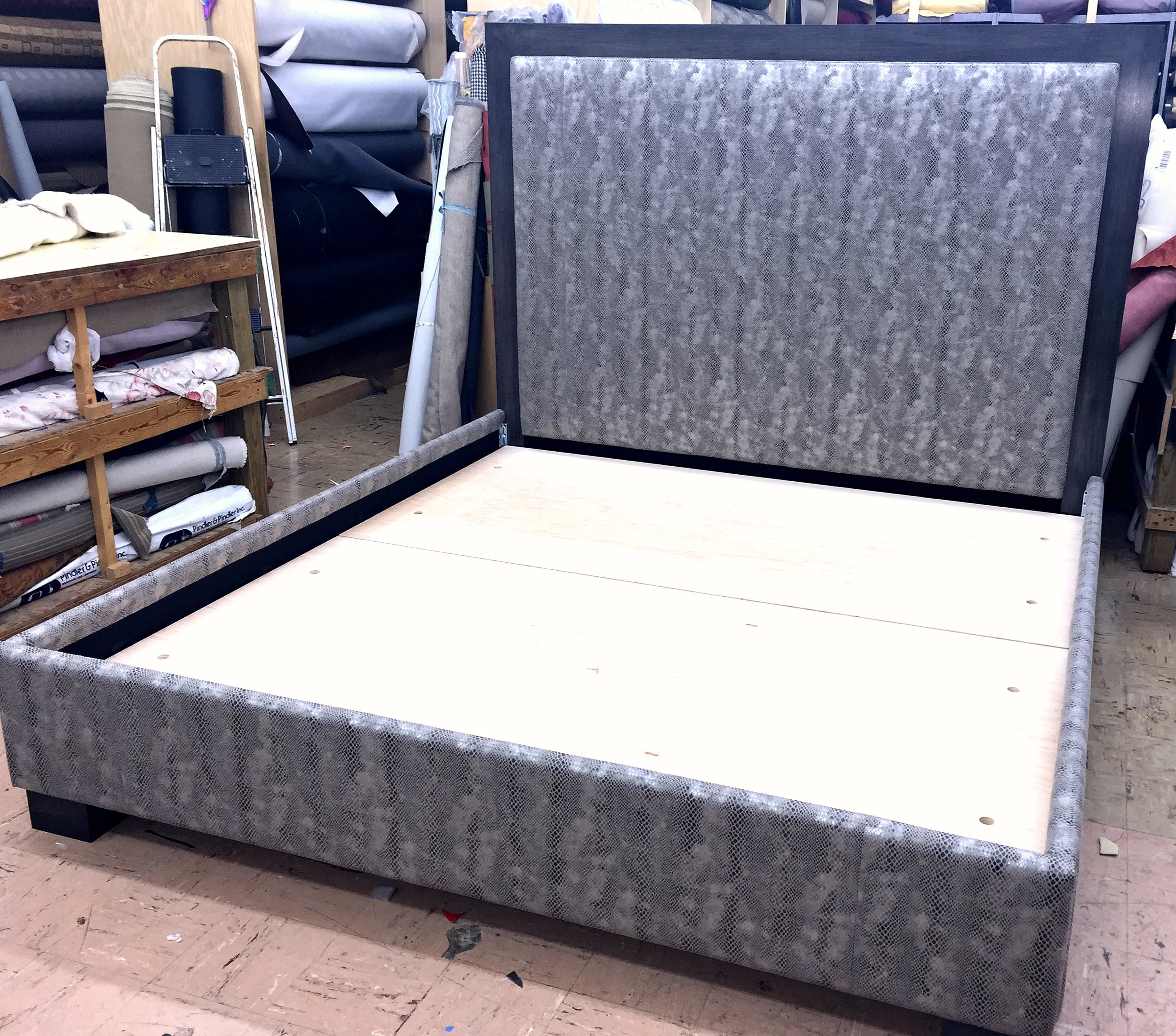 King size bed upholstered in silver snake