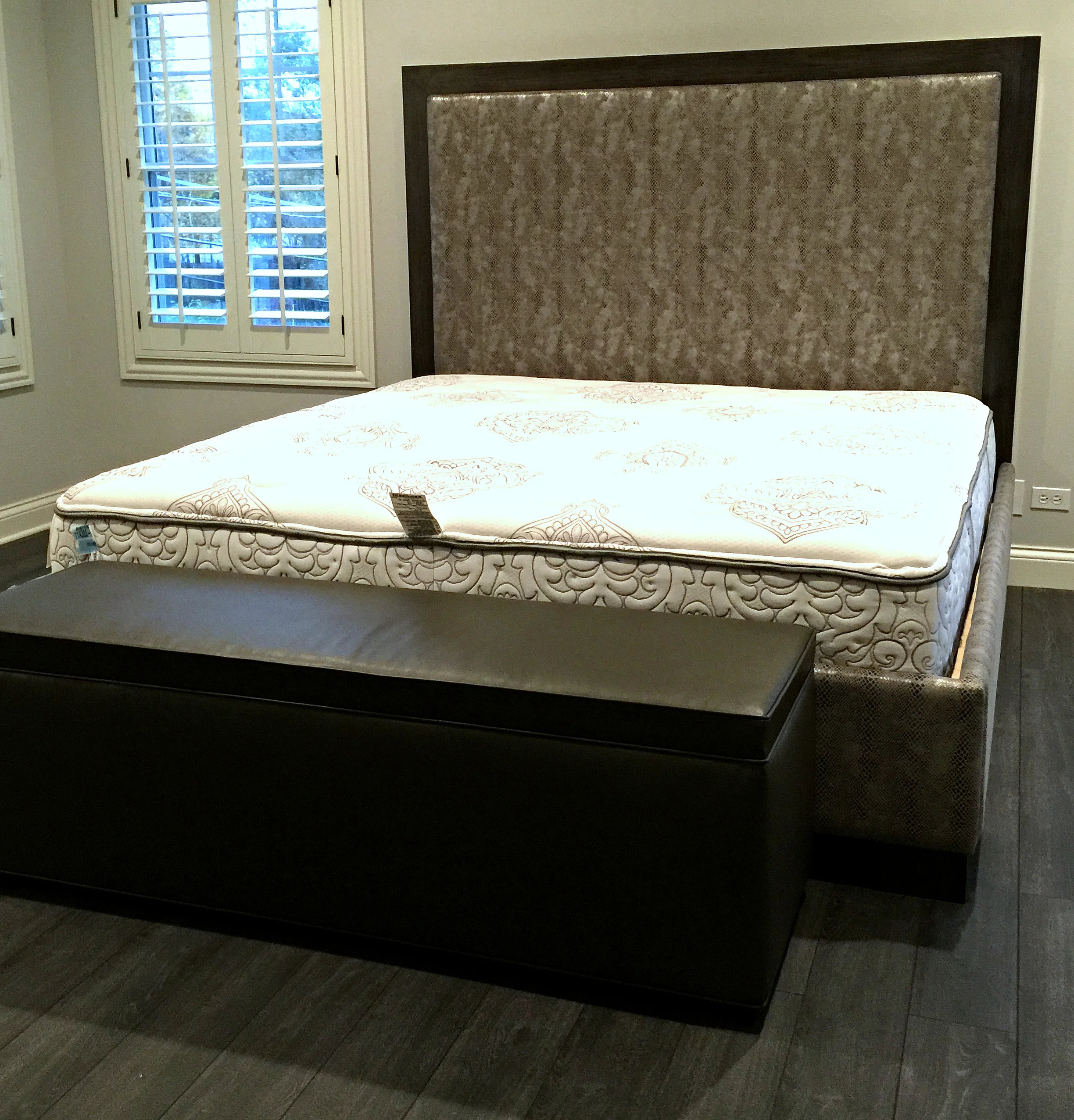 King size bed upholstered in silver snake