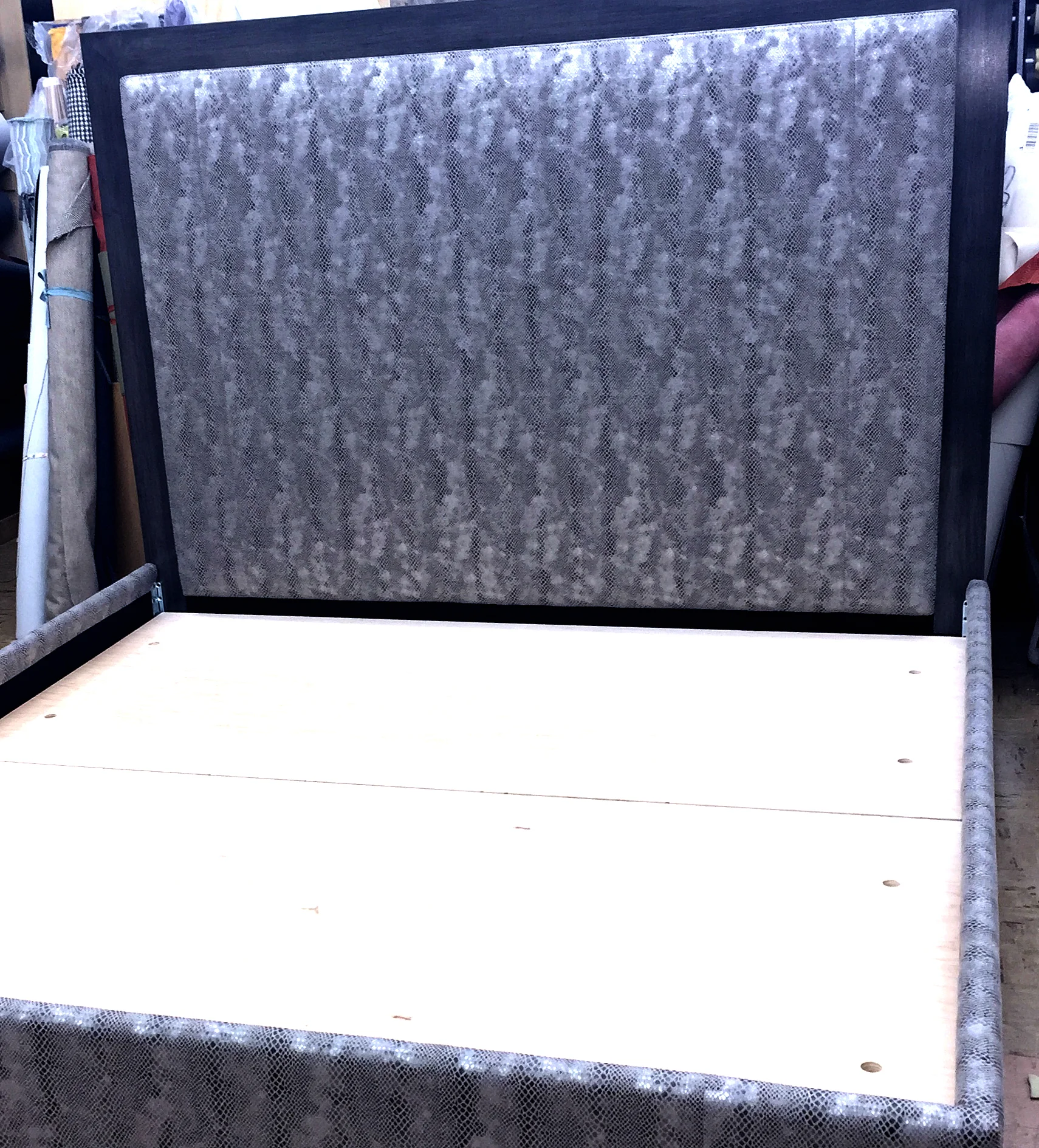 King size bed upholstered in silver snake