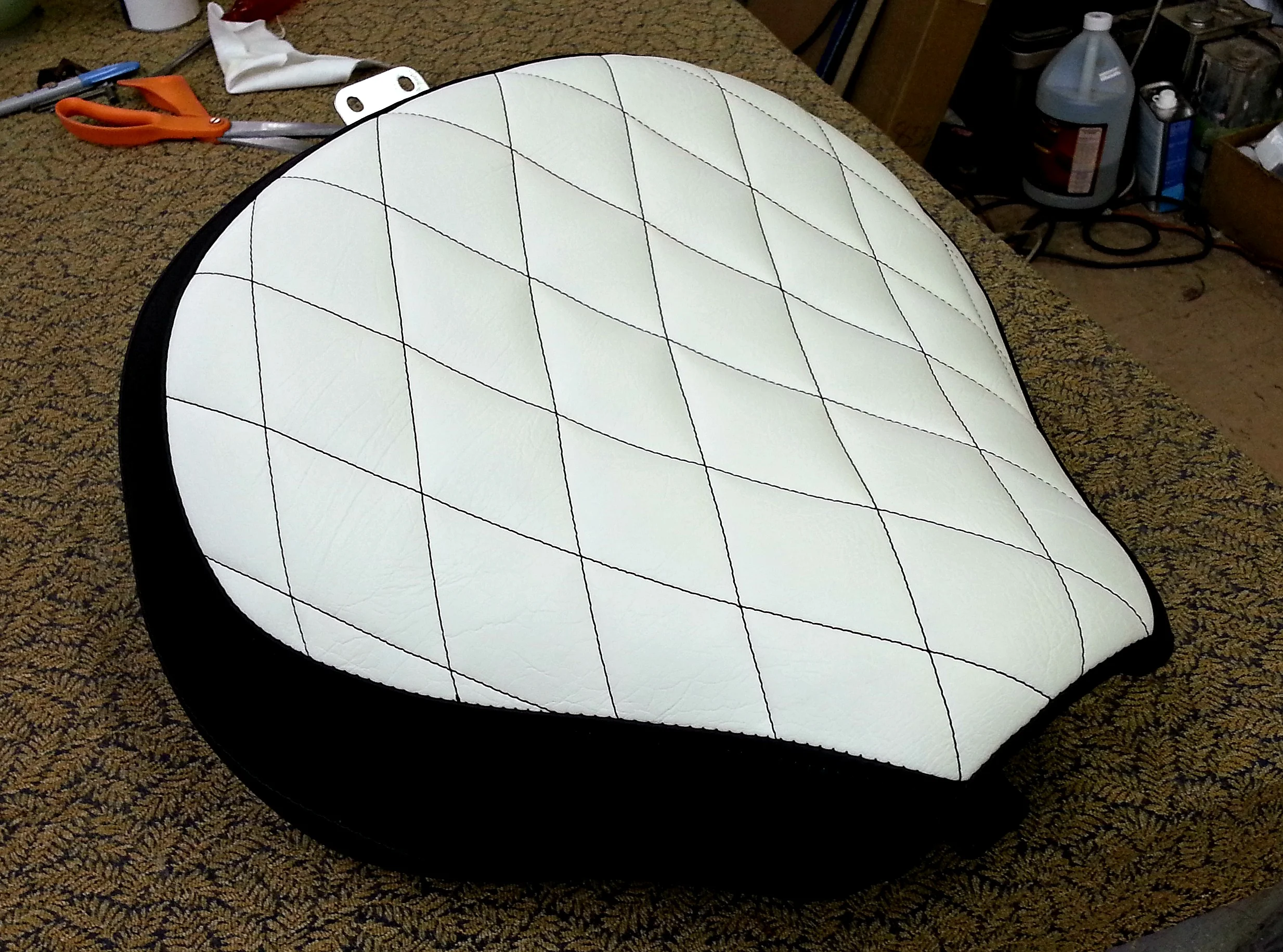 Motorcycle seat with black diamond stitch