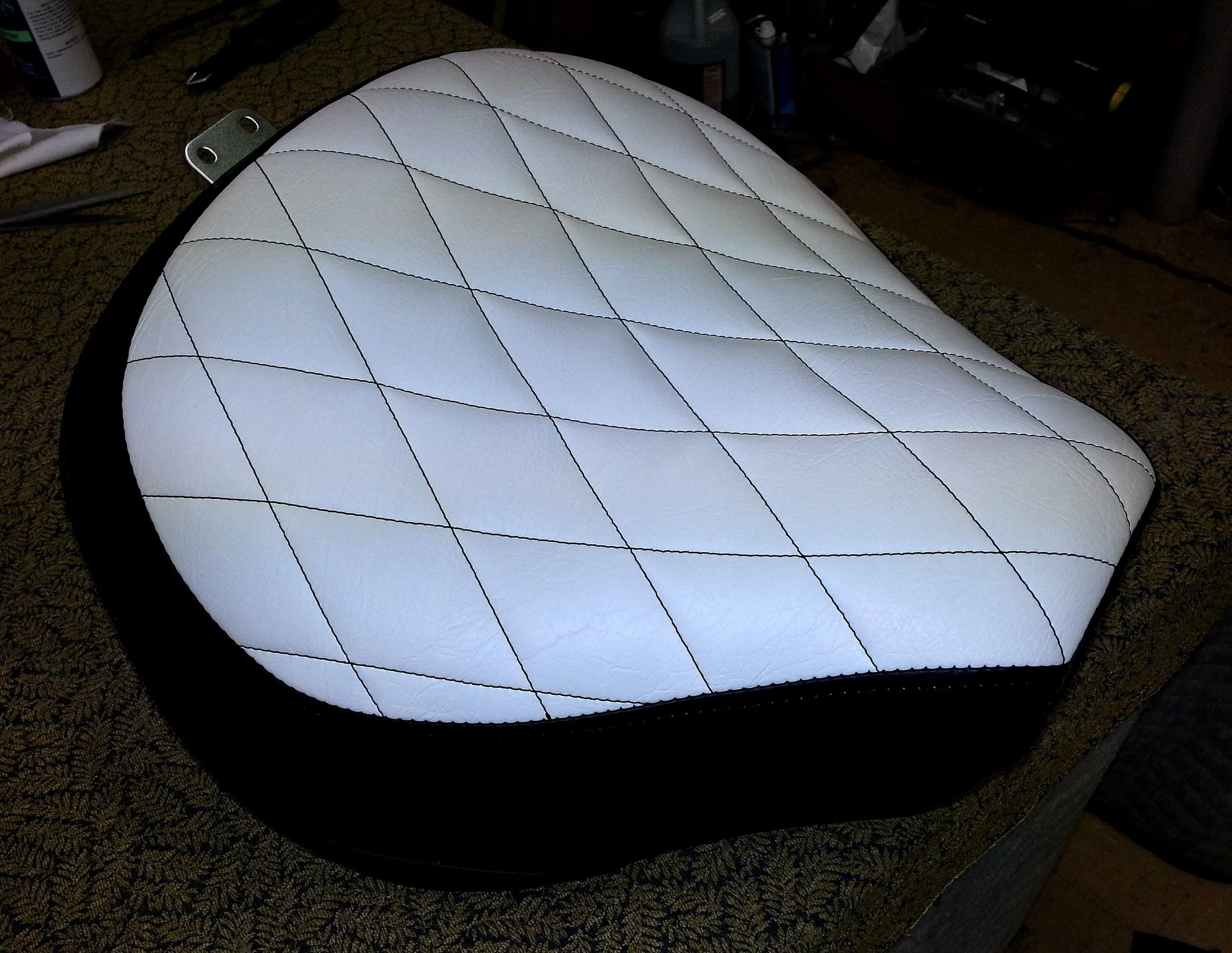 Motorcycle seat with black diamond stitch