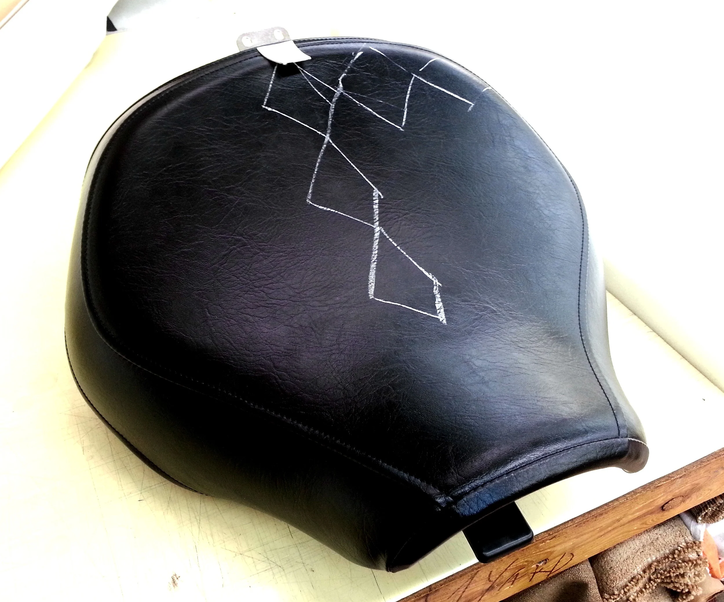 Motorcycle seat with black diamond stitch