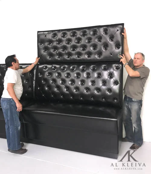 Bar height booth with tufted wall panels