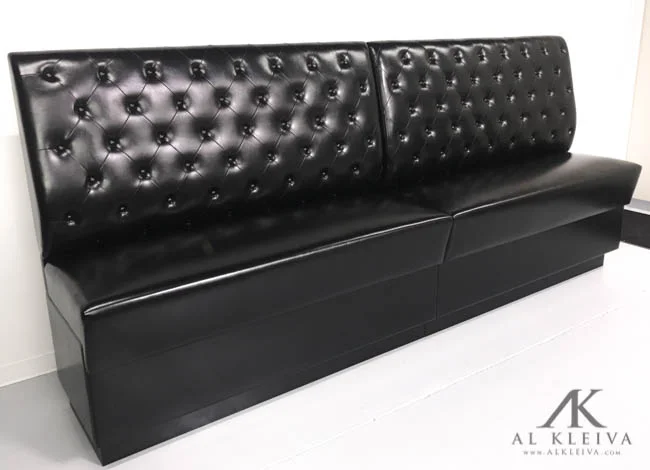 Bar height booth with tufted wall panels