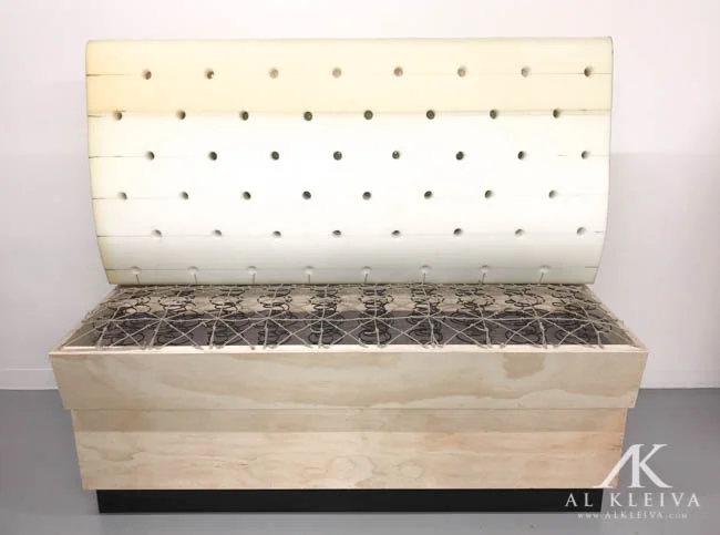 Bar height booth with tufted wall panels