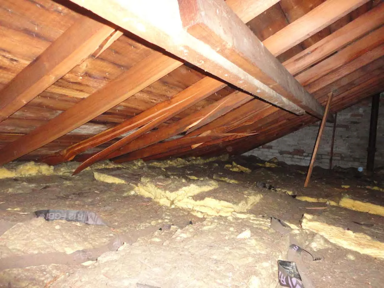 Inspection: inside attic reveals that beams/structure are snapping. Insulation is good.