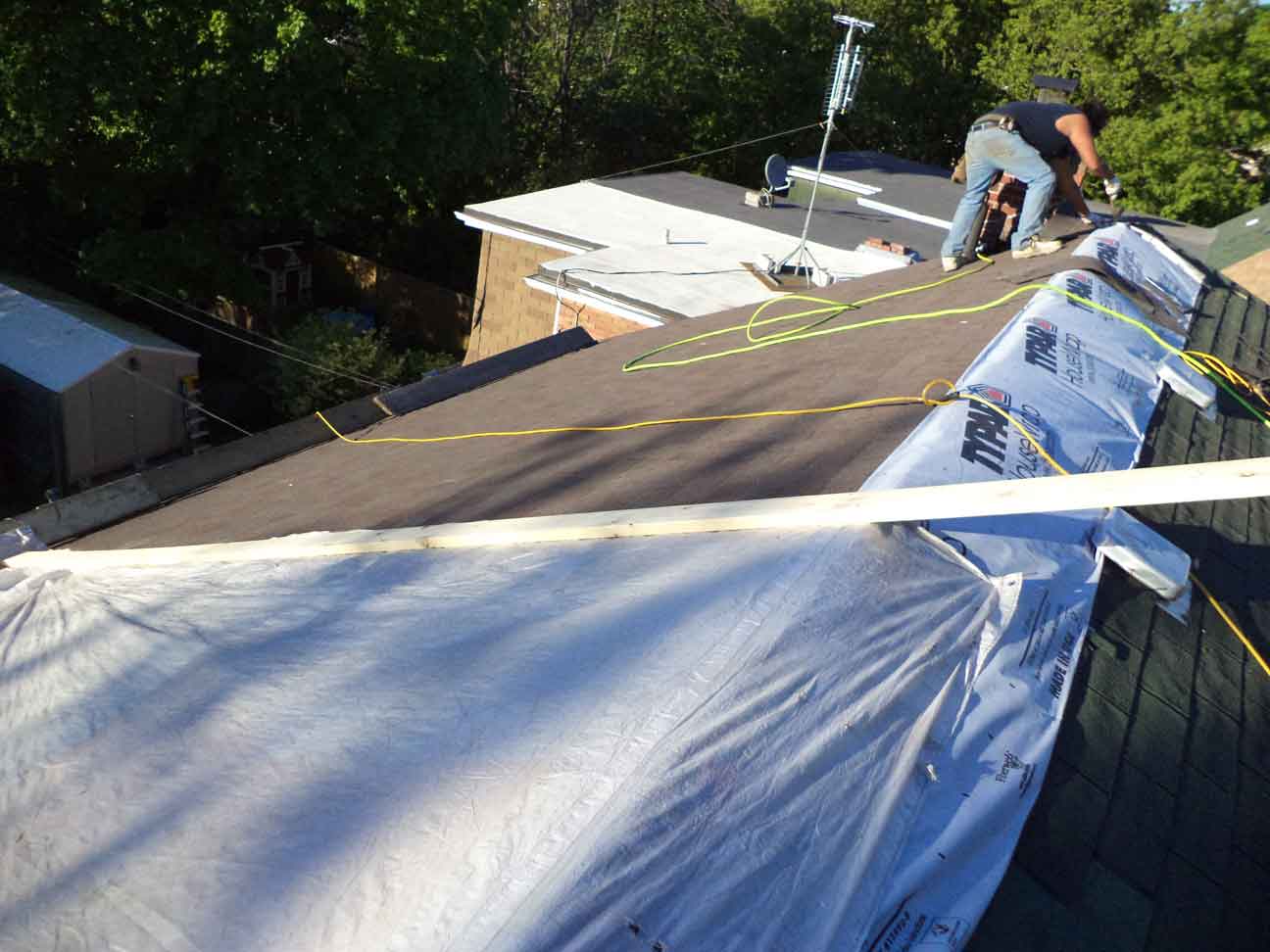 New roof installed and a temporary overnight tarp on the portion that is not yet done. (Job took 10 guys & 4 days to do). 