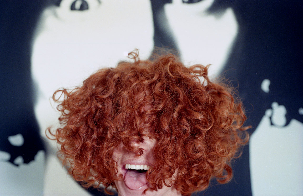 Carrot Top shows off his signature curly hair at his home in Florida.