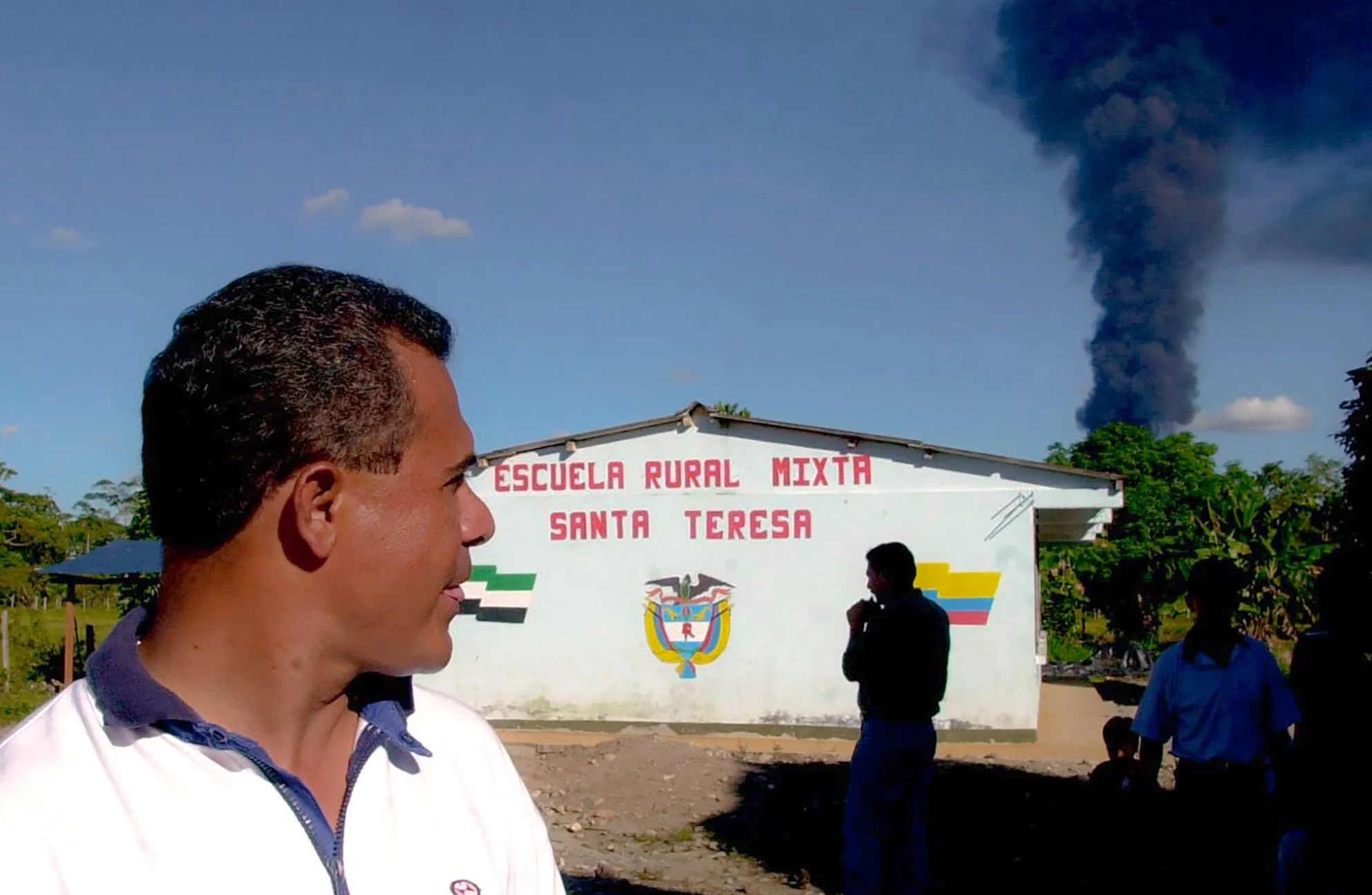 Dark smoke rises from a burning oil line near the town of La Hormiga, Colombia. Unconfirmed reports said the fire was the result of rebel sabotage.