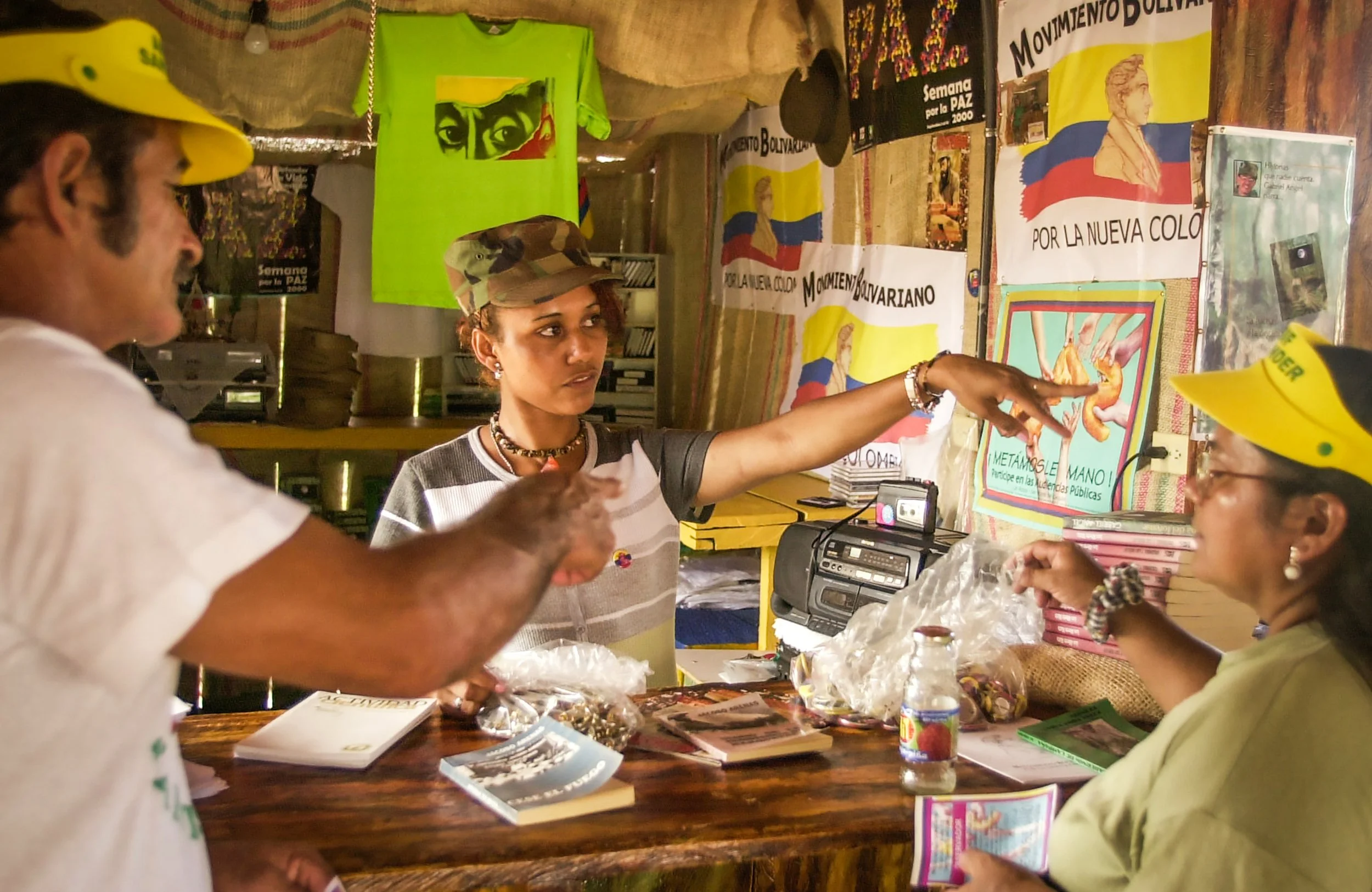 Susana Castro, a 22-year-old, seven-year veteran of the FARC, guides visitors at a FARC gift shop outside of Los Pozos, Colombia.