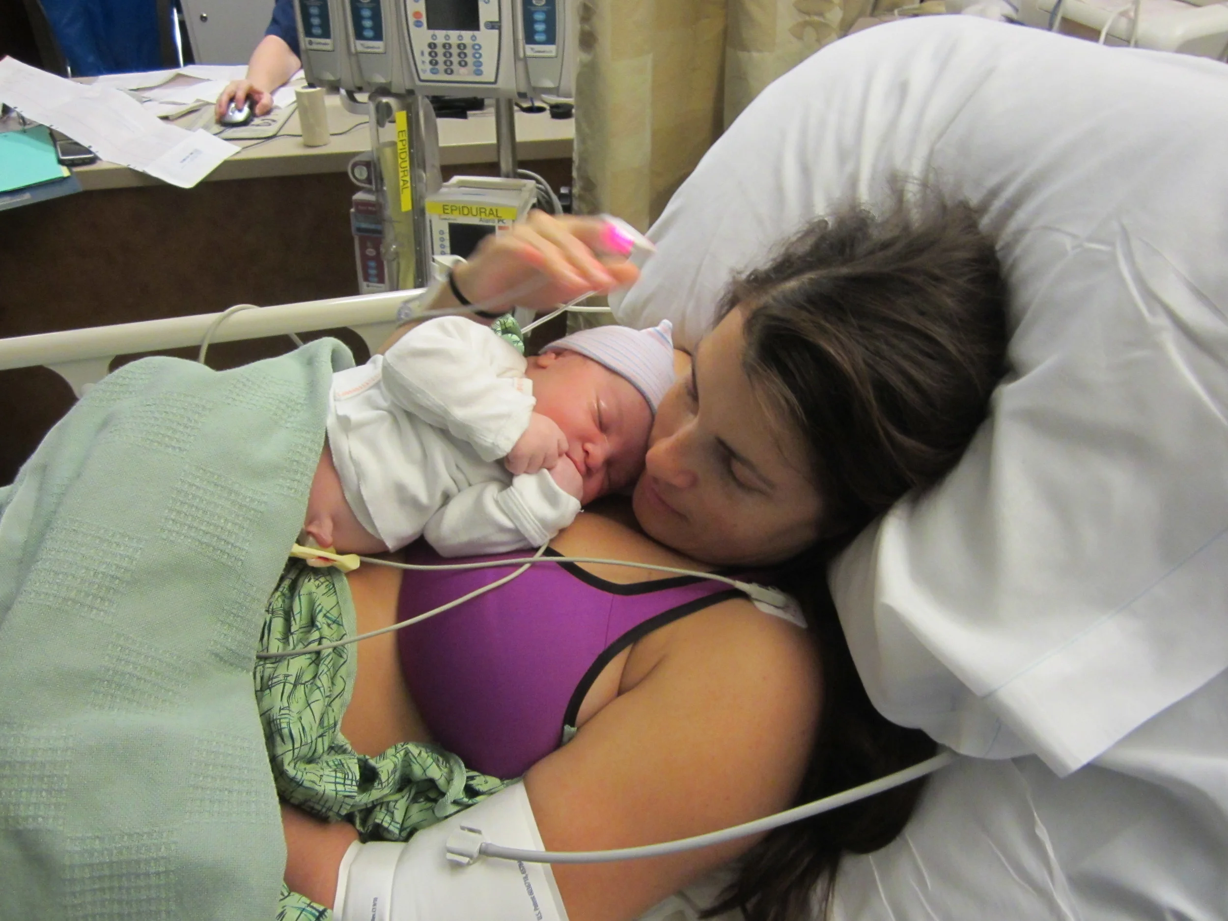 Our version of the Sacred Hour, in the recovery room. She was born with her hand in her mouth like that.