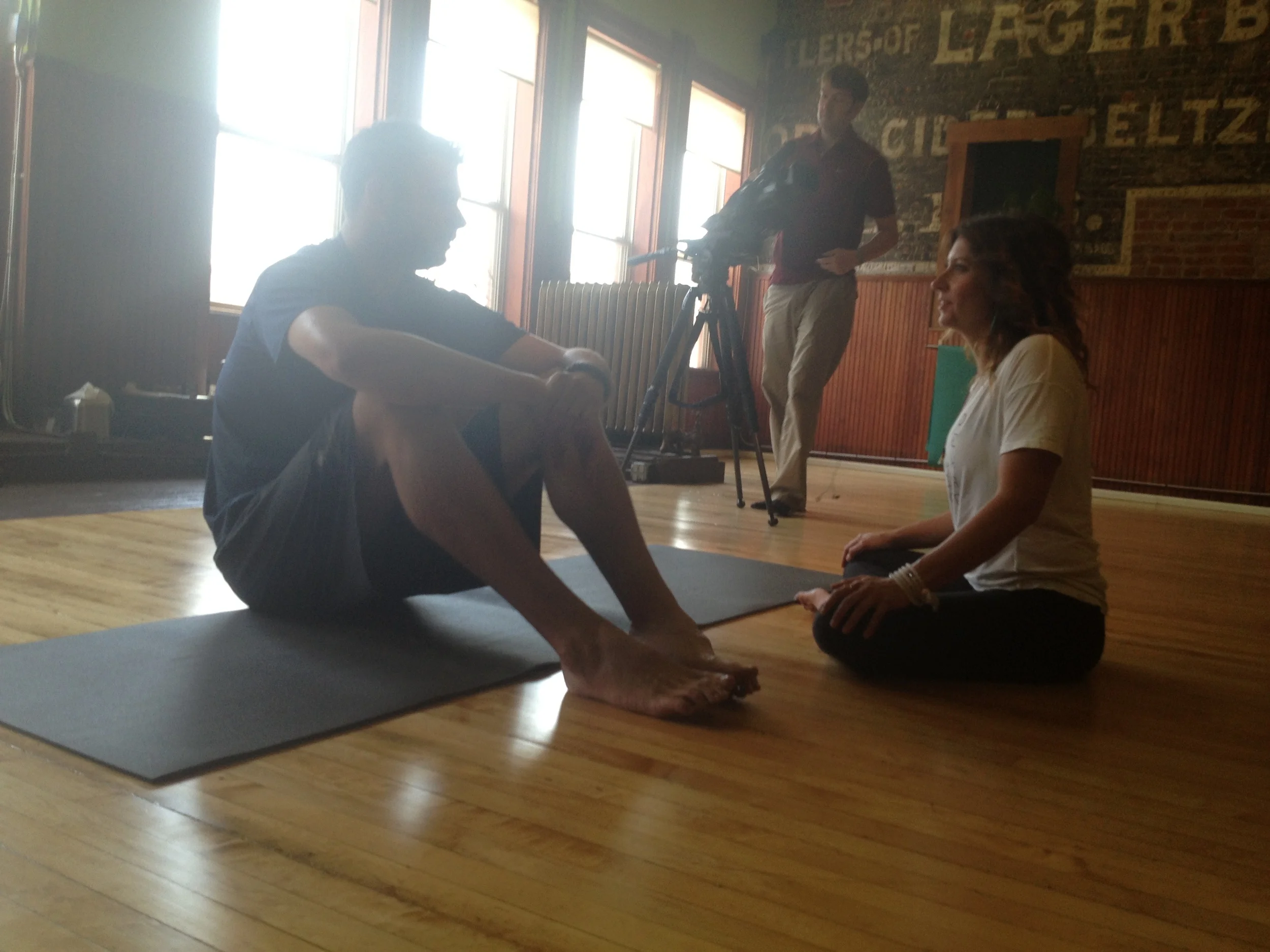 Hard nosed MLB Pitcher Jason Hirsh and advisory board member Lora McCarvile of Crieghton University Photo Credit: Marc Stout during Root Sports Promo Shoot for Coors Field Yoga Day 2013