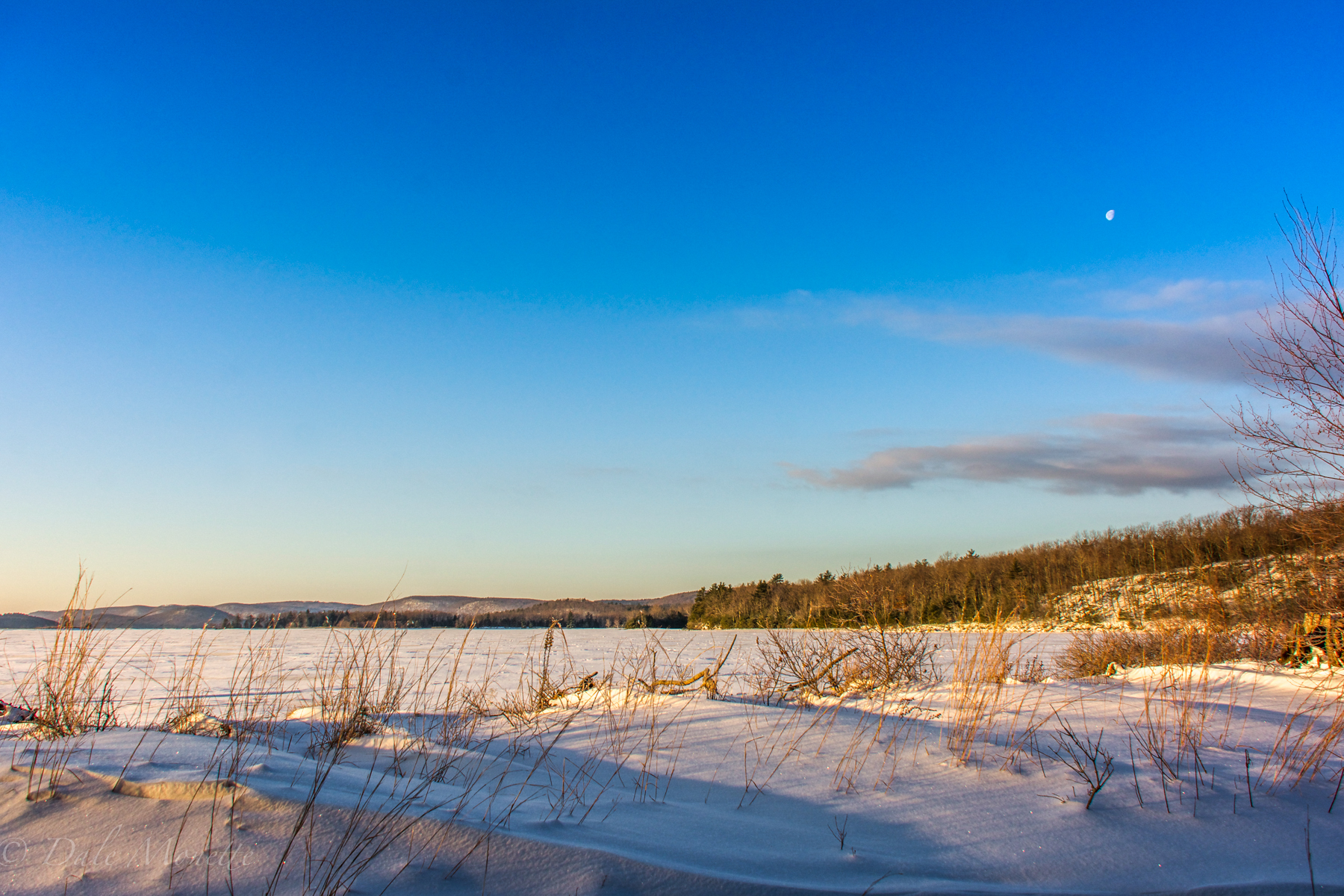 A cold 15 degree F winters day with the moon in the upper right corner of the photo.