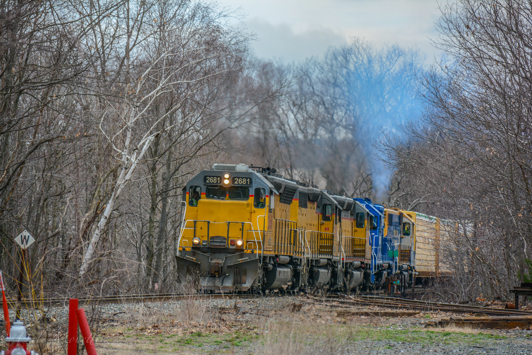 New England Central crawls across the Millers Falls bridge with a long trail….