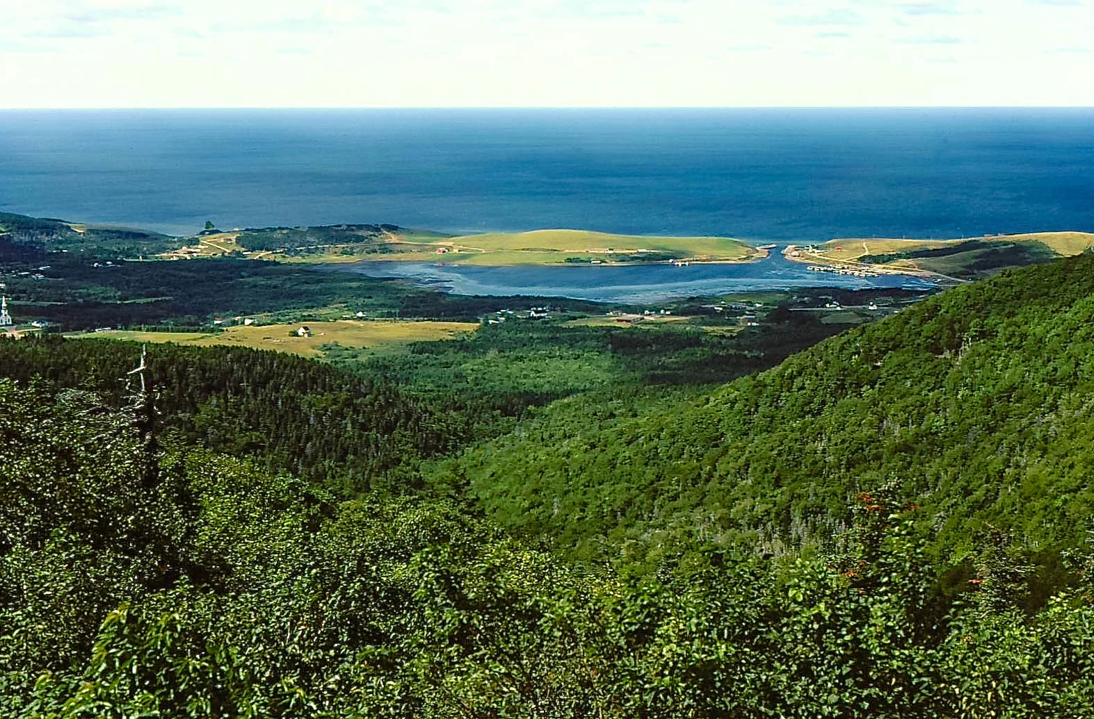 This photo is Bay St. Lawrence taken from the access road to Money Point in the early 1990's. Newfoundland is 40 miles away straight out.