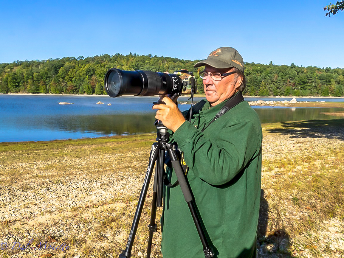   Here's a photo taken of me and the Nikkor 200-500mm f/5.6E ED VR lens and my Nikon D810 camera. I now use a Nikon D850 camera and a Nikon 500mm, F4 ED VR lens most of the time.  