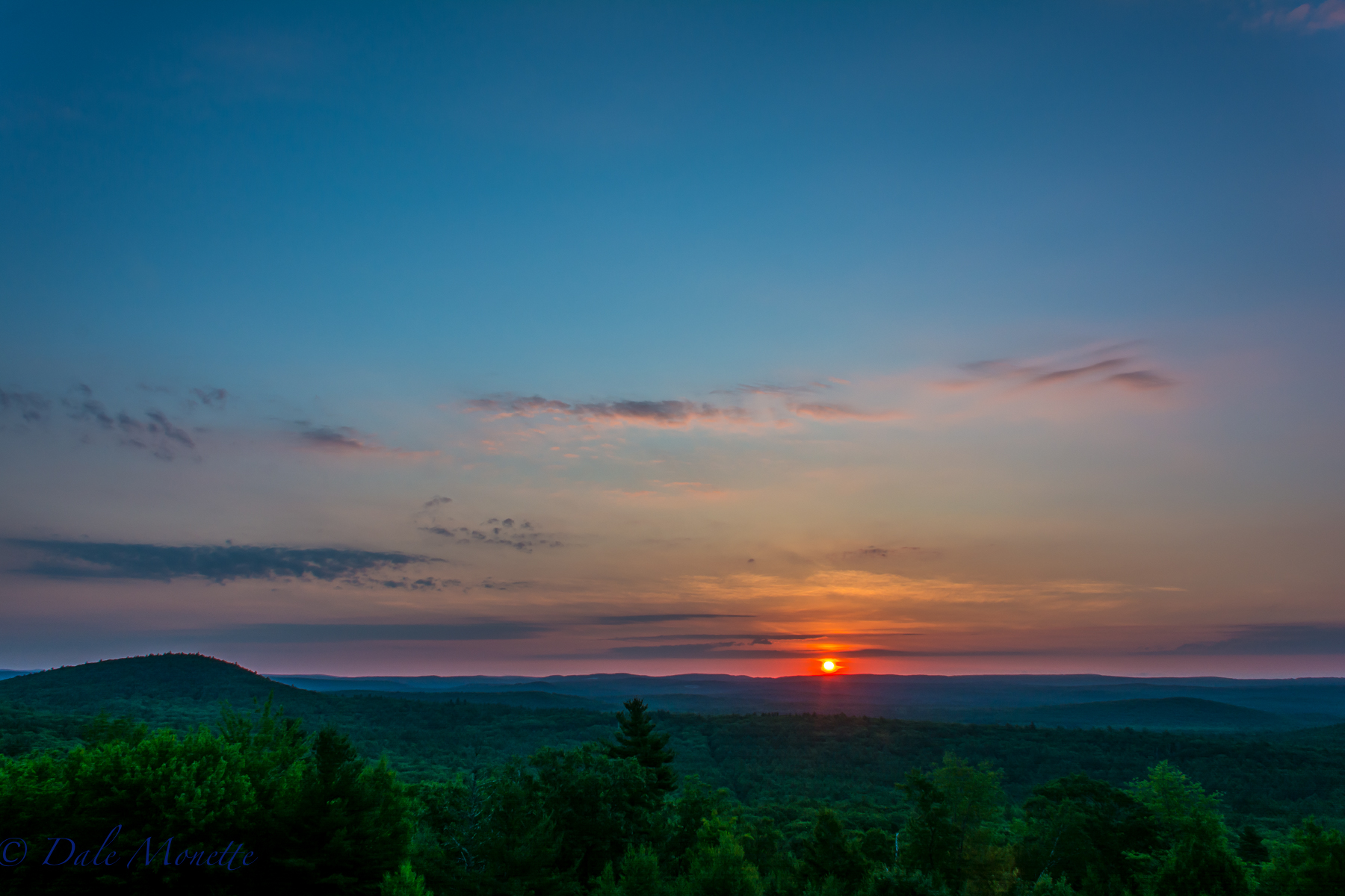 Sunrise on a hot summers morning. New Salem MA looking over the northern Quabbin and the southern part of Athol, MA. 7/12/16