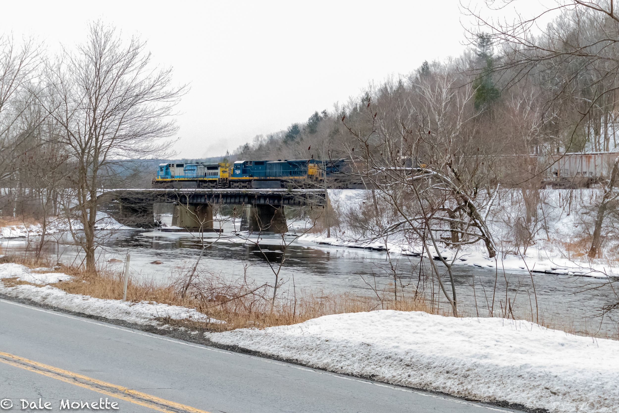   Eastbound Pan Am RR freight train heading over the Millers River in Erving MA taken from RT 2.  