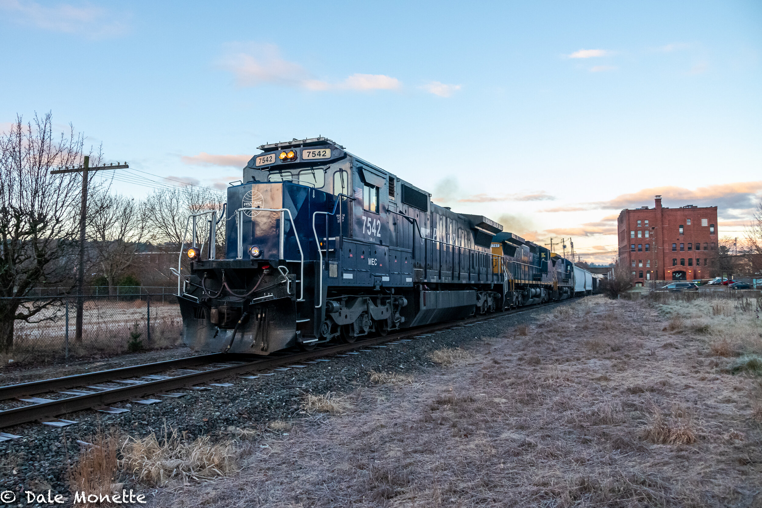   Another Pan Am freight train headed for Portland Maine thru Orange MA at sunrise.  The Franklin County Courthouse in on the right hand side of the image.  