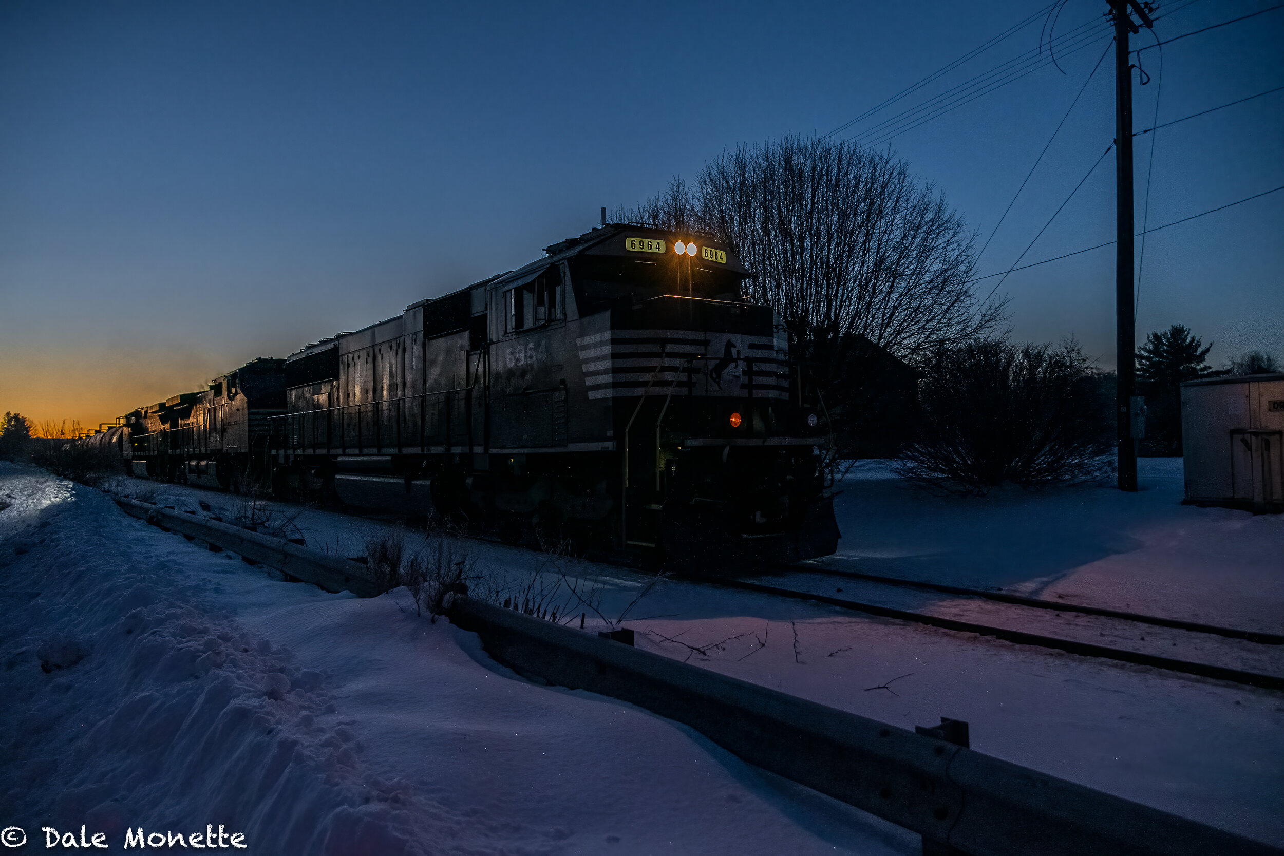   A Pan Am freight train creeps thru Orange Ma. at sunrise on February 12, 2021.  