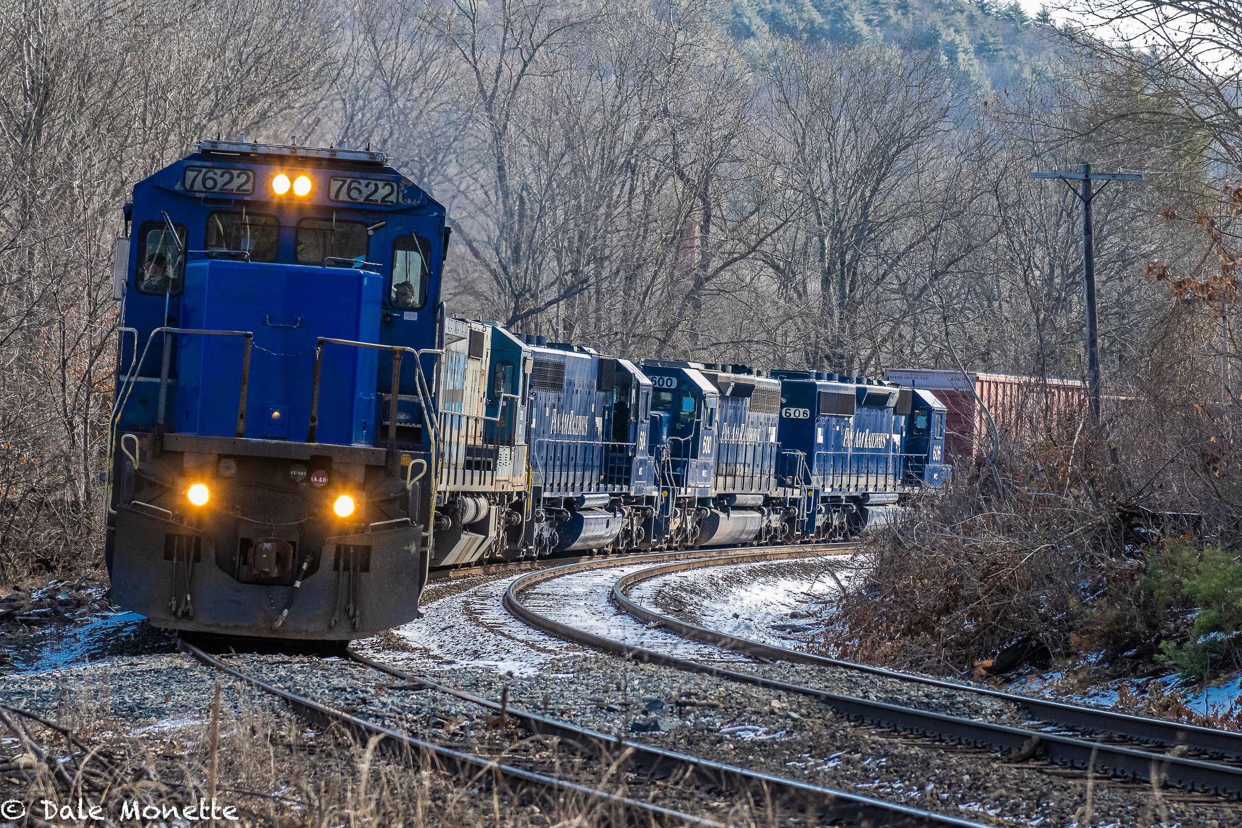   Portland to East Deerfield rumbling into Millers Falls MA.  316 axels and 3,549 feet long.  Five diesels made the earth quake!     I love trains….  