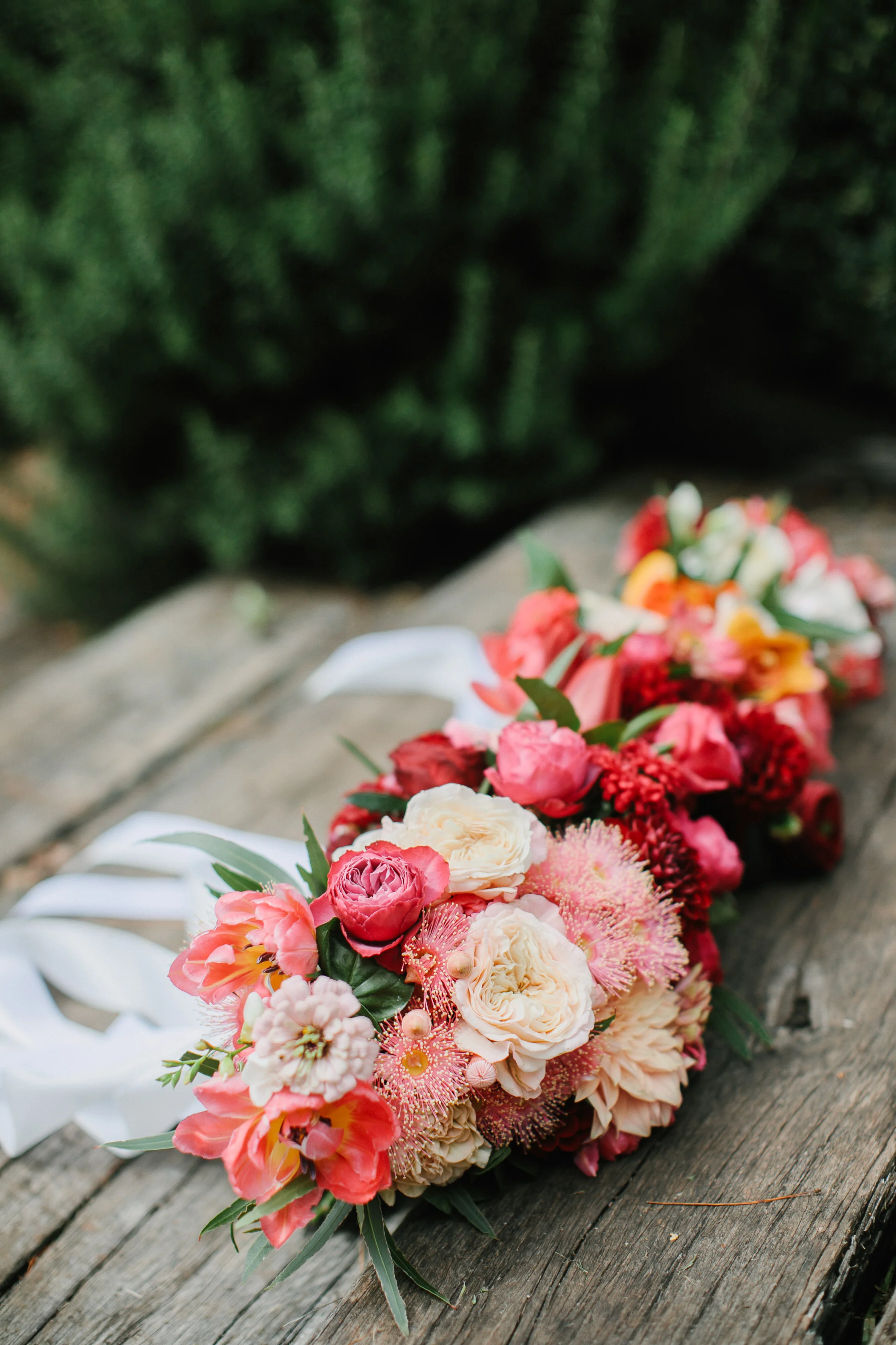 Zinnias, roses, flowering gum, tulips and dahlias - a candy inspired early Autumn bouquet. Photography by Bear Deer Fox.