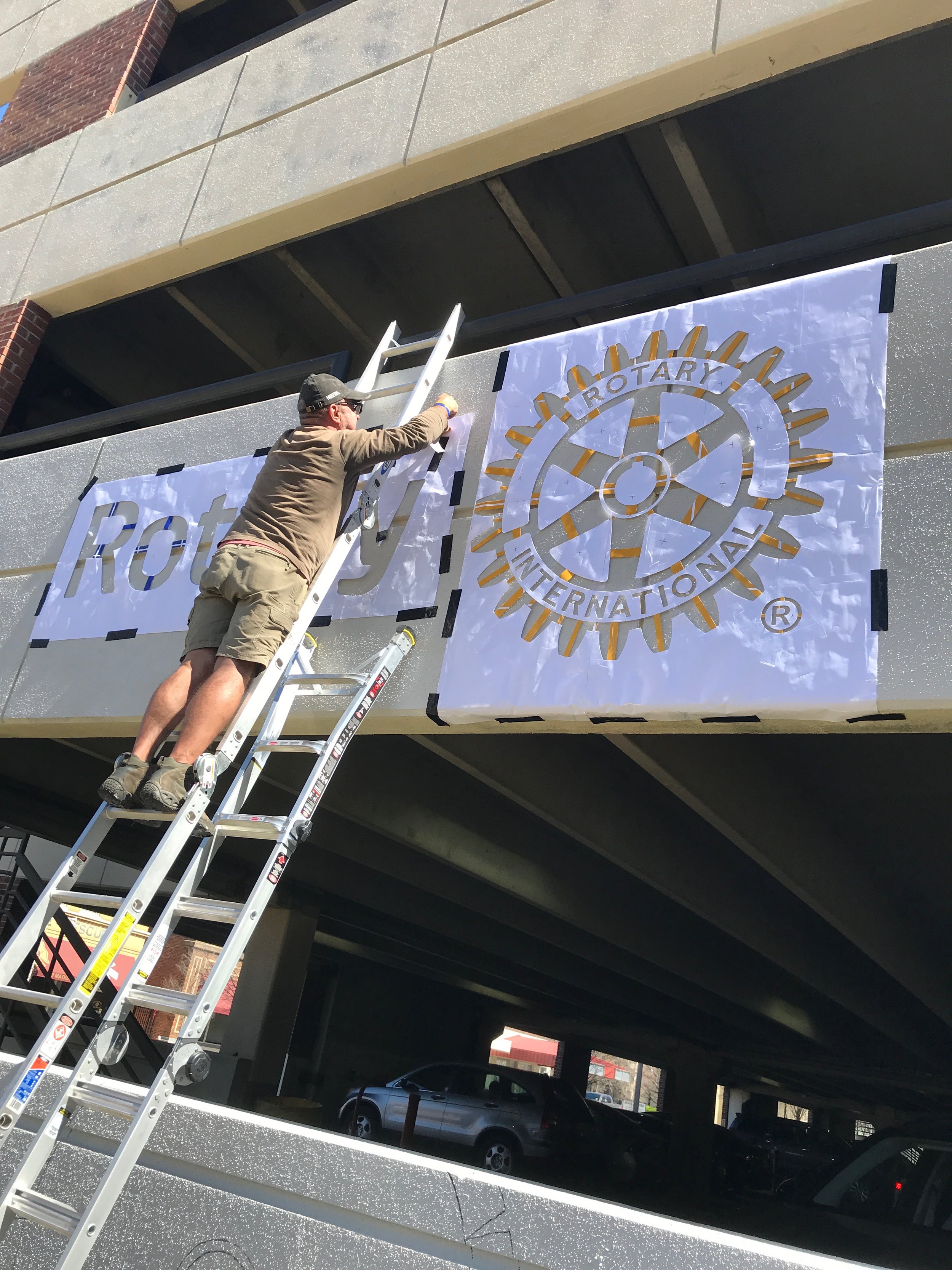  Day Four: Rotary Club logo stencil goes up! 