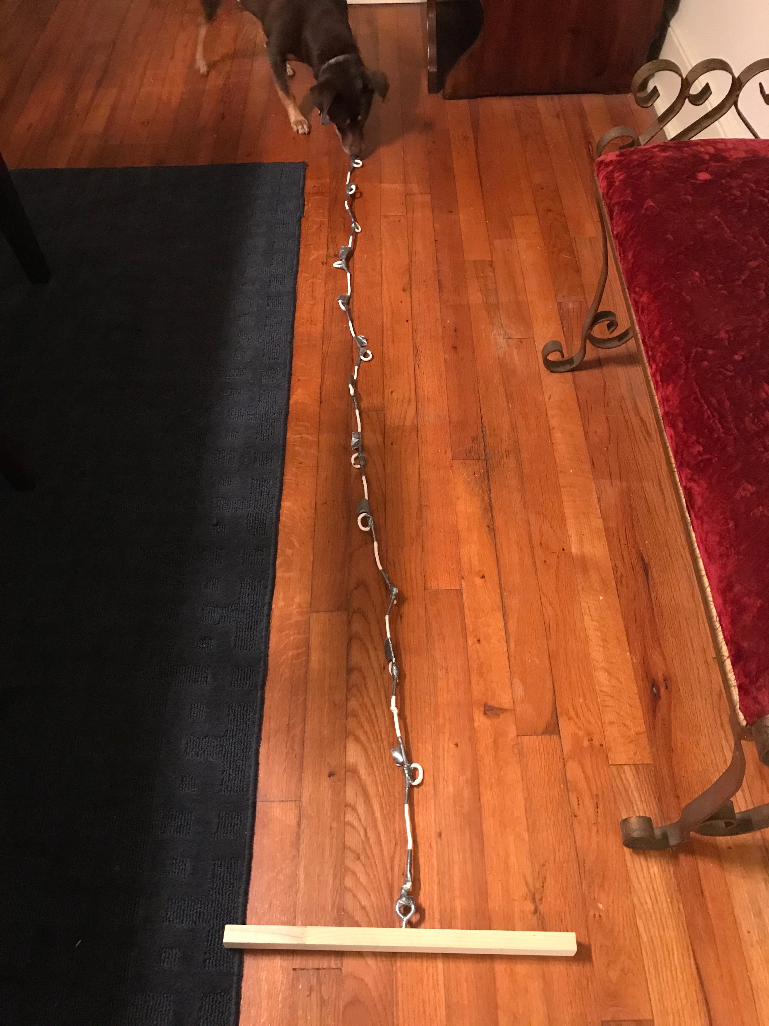  My homemade compass to draw the cogs. Wooden stick, eye hook, laundry line rope, duct tape. 6'7" in total length with marker holders every 6." 