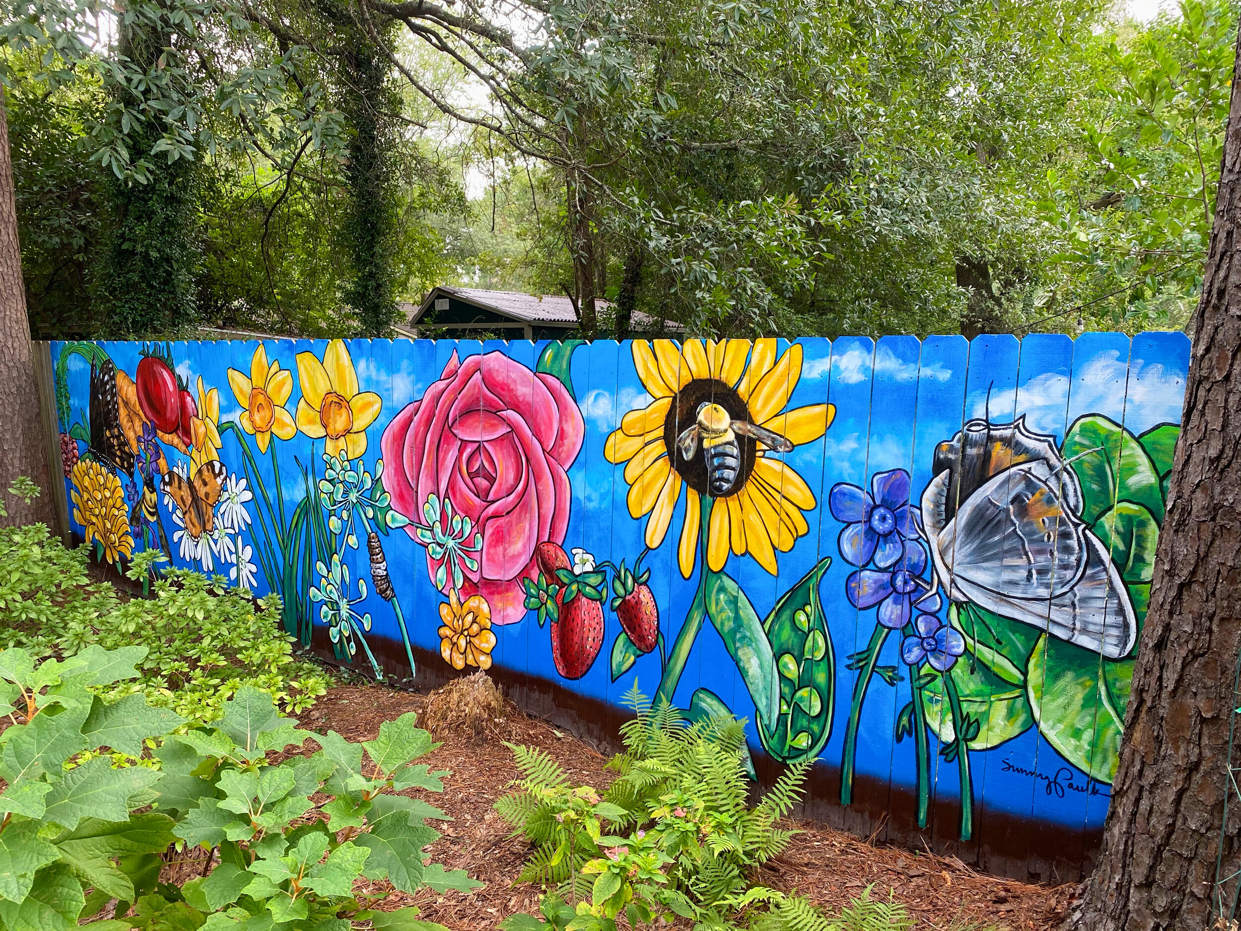   From Blight to Beauty.  Old Cloverdale Community Garden mural, Montgomery, AL. 25’x6’ exterior latex on wood. October 2020. 