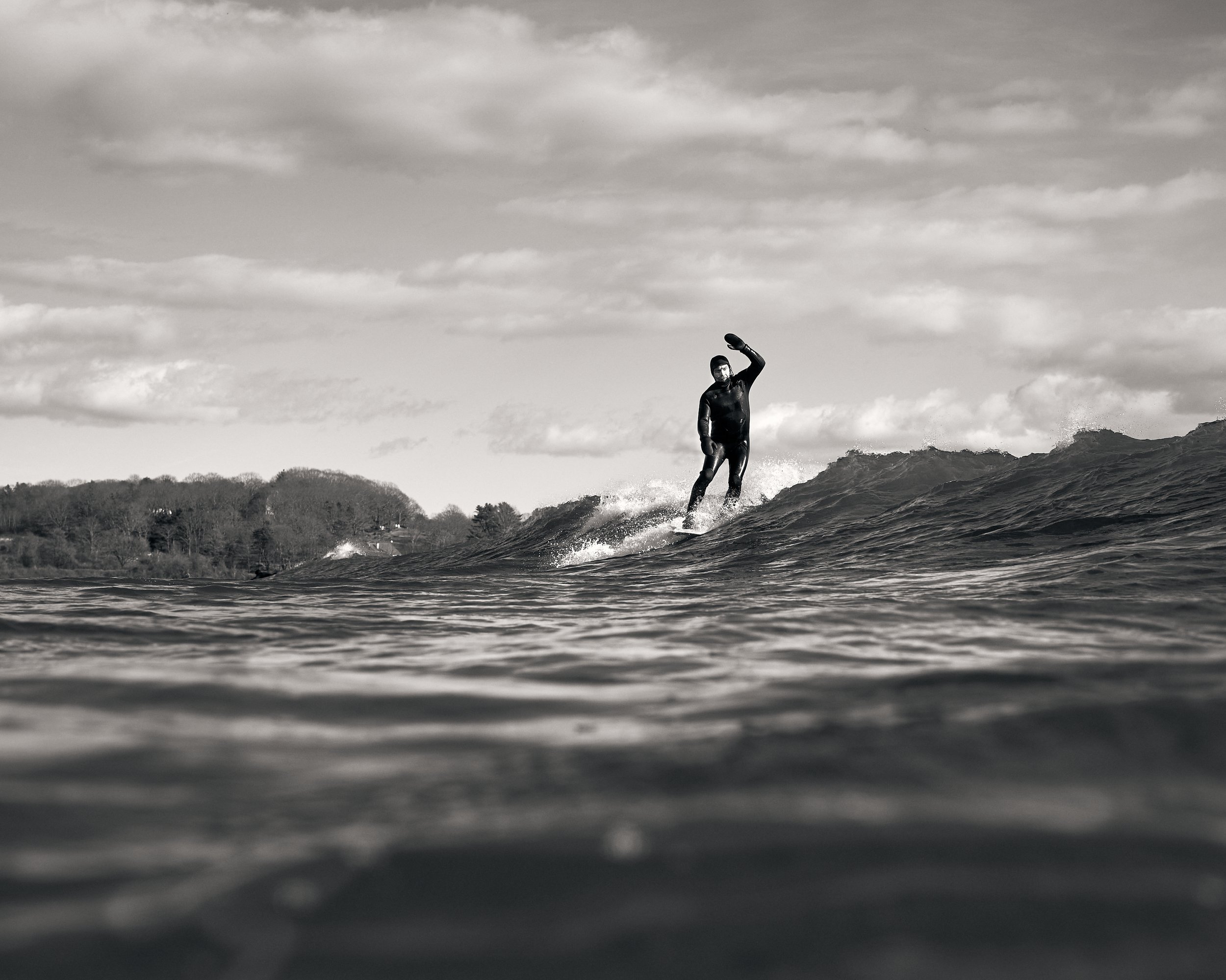 A surfer nose riding a breaking wave, Higgins Beach, Surf Photography, Maine