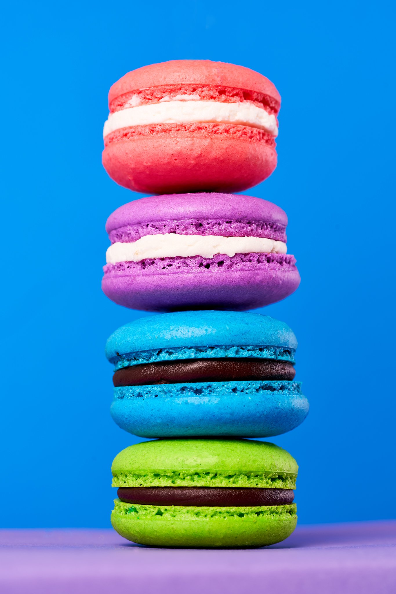 Pink, Purple, blue and green macarons, blue backdrop, food photography, Ben Macri, Maine