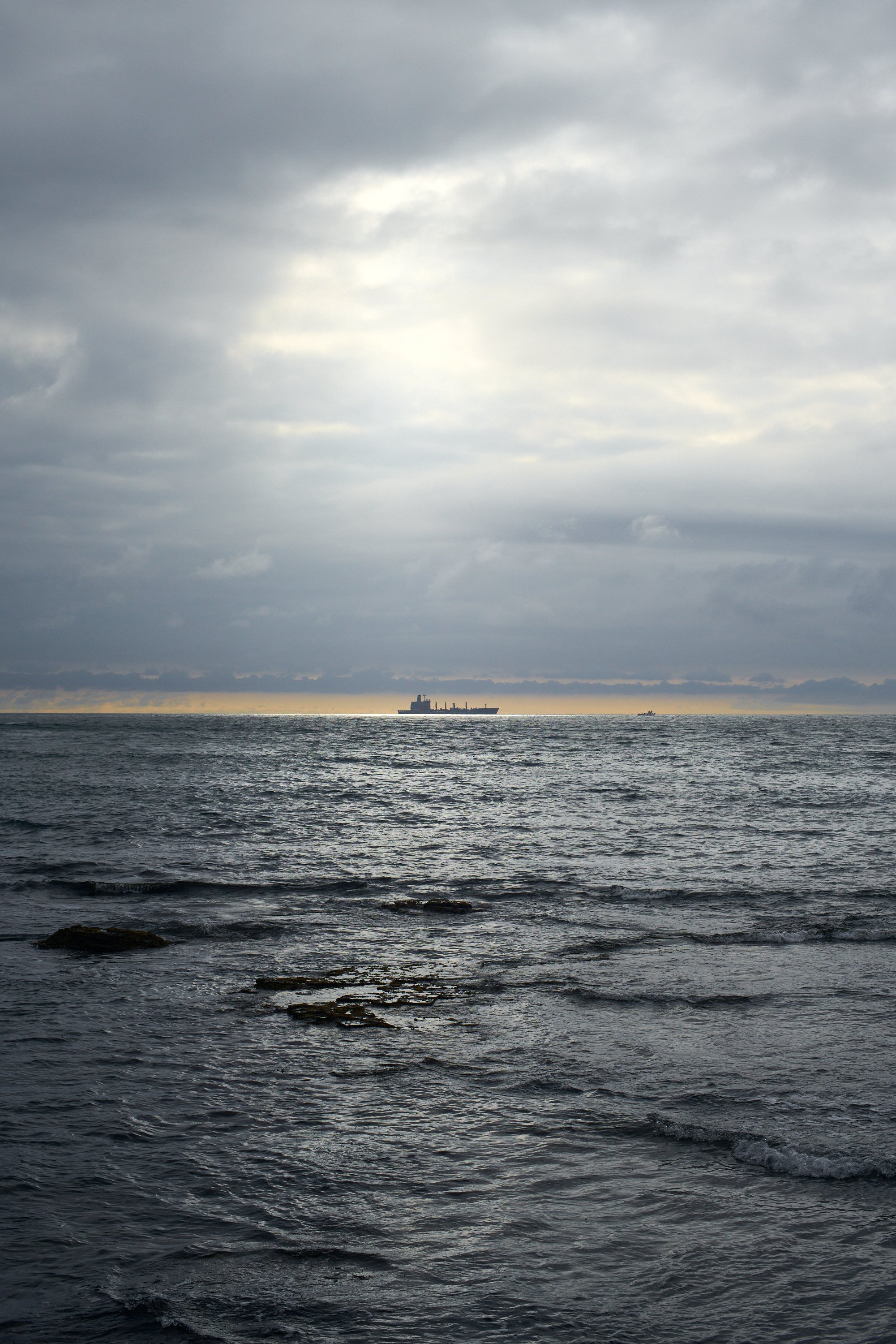 A ship on the horizon basking in sun rays, Sunset Cliffs, San Diego, Travel Photography, Ben Macri.